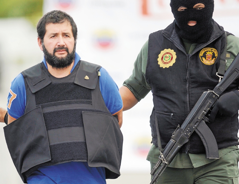 Colombian drug dealer Daniel "El Loco" Barrera is seen in Caracas before being deported to Colombia, on November 14, 2012. AFP PHOTO/LEO RAMIREZ