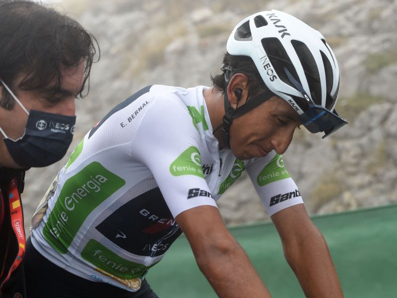 Team Ineos' Colombian rider Egan Bernal is helprd after crossing the finish line during the 18th stage of the 2021 La Vuelta cycling tour of Spain, a 162.6 km race from Salas to Altu d'El Gamoniteiru in Pola de Lena, on September 2, 2021.  (Photo by MIGUEL RIOPA / AFP)
