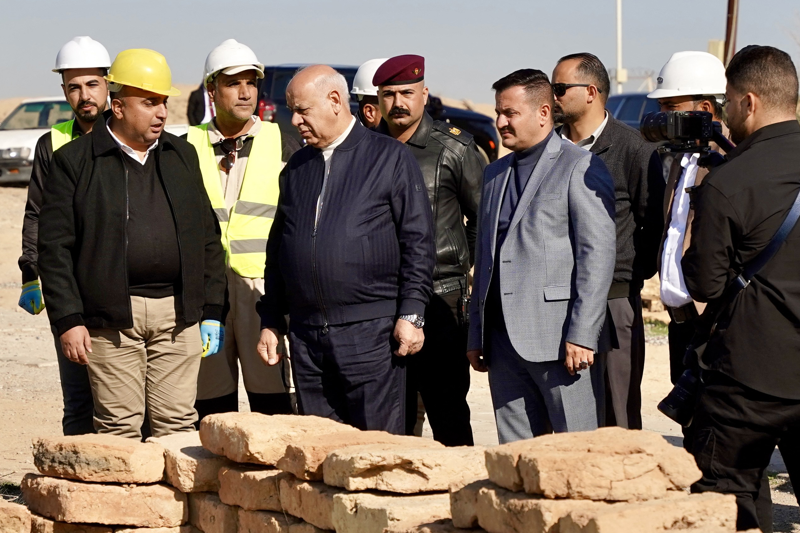 Iraq's Culture Minister Ahmed Fakak al-Badrani (C-L) visits the archaeological site of Nimrud, south of Mosul, on January 3, 2025.