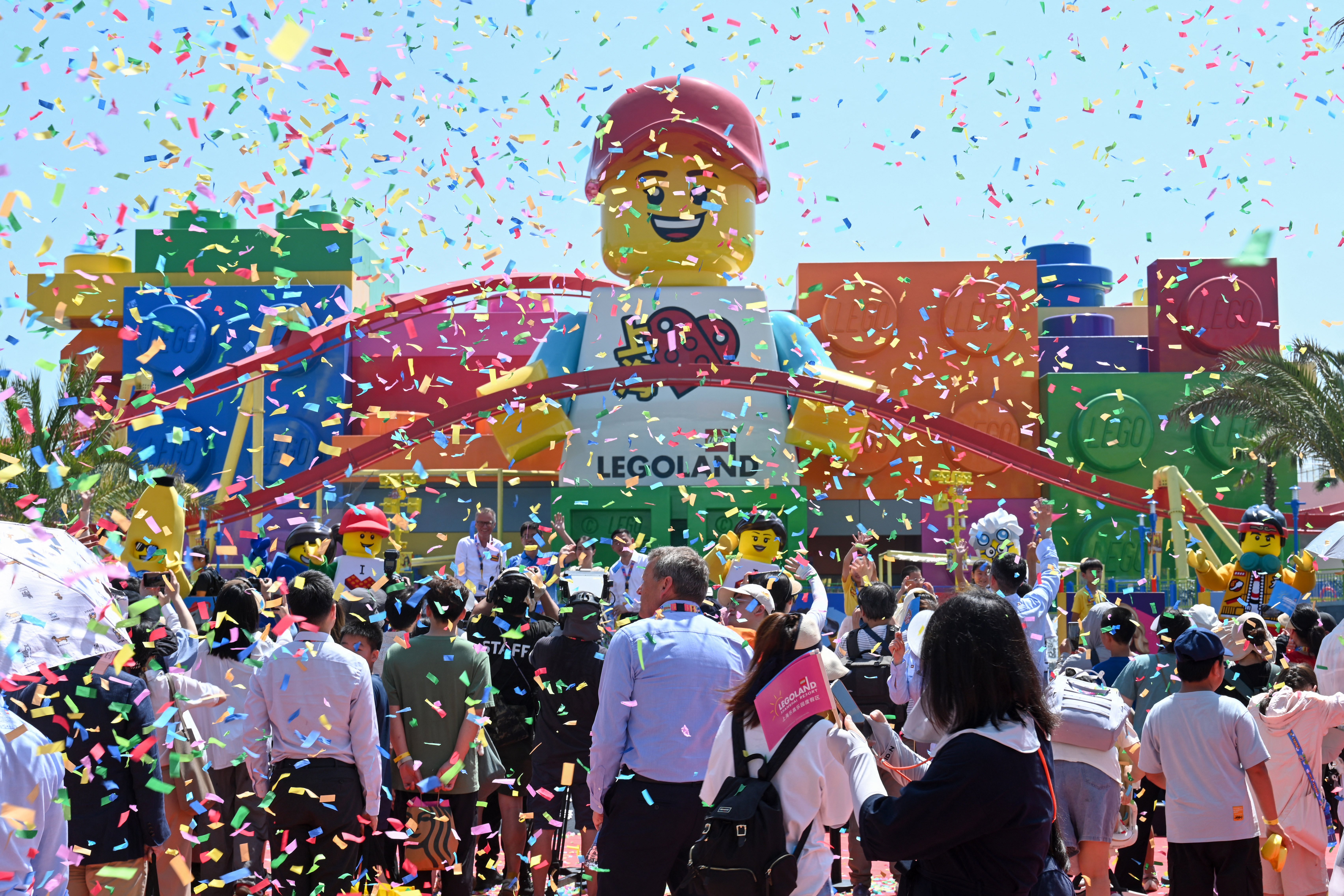 People attend the grand opening ceremony of the Legoland Shanghai Resort, the world's largest Legoland theme park, in Shanghai on July 5, 2025. (Photo by AFP) / CHINA OUT