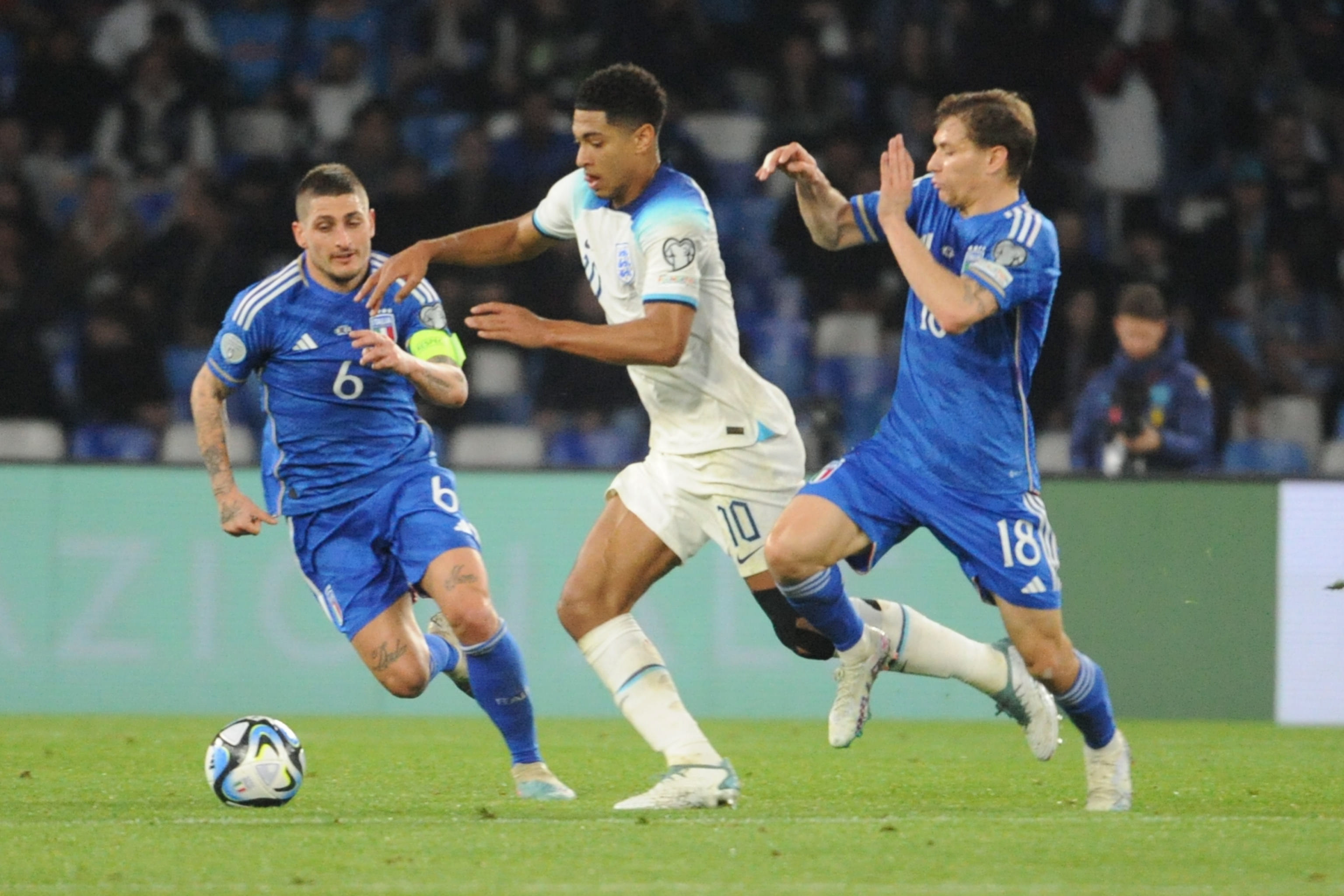 Naples (Italy), 23/03/2023.- (FILE) - Marco Verratti (L) and Nicolo Barella of Italy in action against Jude Bellingham (C) of England during the UEFA EURO 2024 qualification soccer match between Italy and England in Naples, Italy, 23 March 2023 (reissued 07 June 2023). Spanish LaLiga club Real Madrid have signed England international Jude Bellingham from German Bundesliga side Borussia Dortmund for a transfer fee of at least 103 million euro, according to a statement released by Dortmund on 07 June 2023. (Italia, Rusia, Nápoles) EFE/EPA/CESARE ABBATE