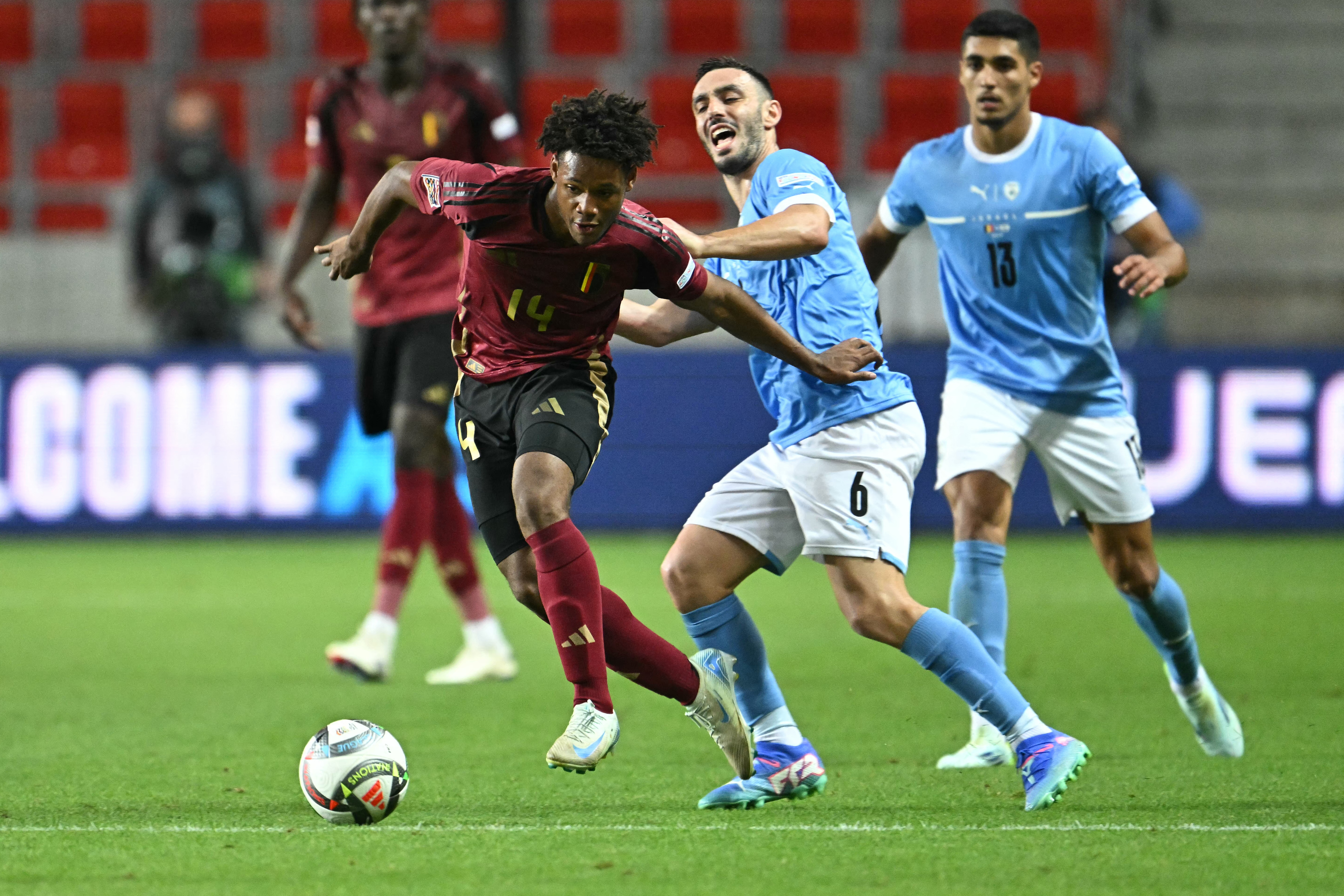 Belgium's midfielder #14 Julien Duranville (L) and Israel's midfielder #06 Neta Lavi vie for the ball during the UEFA Nations League football match League A, Group A2, Day 1, Belgium v Israel in Debrecen, Hungary, on September 6, 2024.