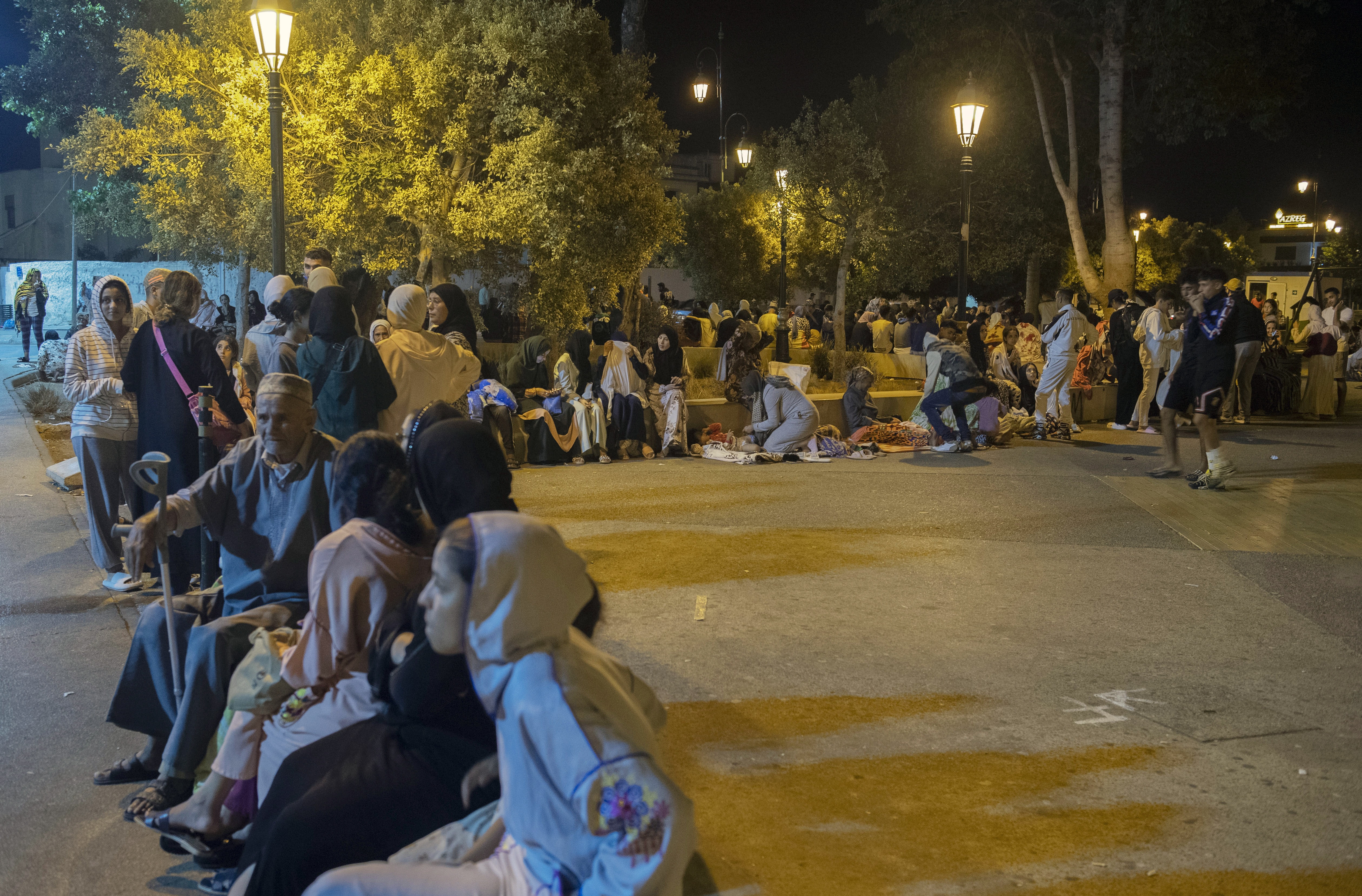 Rabat (Morocco), 08/09/2023.- People seek safety outside after an earthquake in Rabat, Morocco, 08 September 2023. A 6.8-magnitude earthquake struck Morocco late 08 September, damaging buildings in major cities and sending panicked people pouring into streets and alleys. According to Morocco's state-run media, at least 296 people died in the earthquake in the provinces and prefectures of Al Haouz, Marrakech, Ouarzazate, Azilal, Chichaoua and Taroudant, and 153 people were injured. (Terremoto/sismo, Marruecos) EFE/EPA/Jalal Morchidi