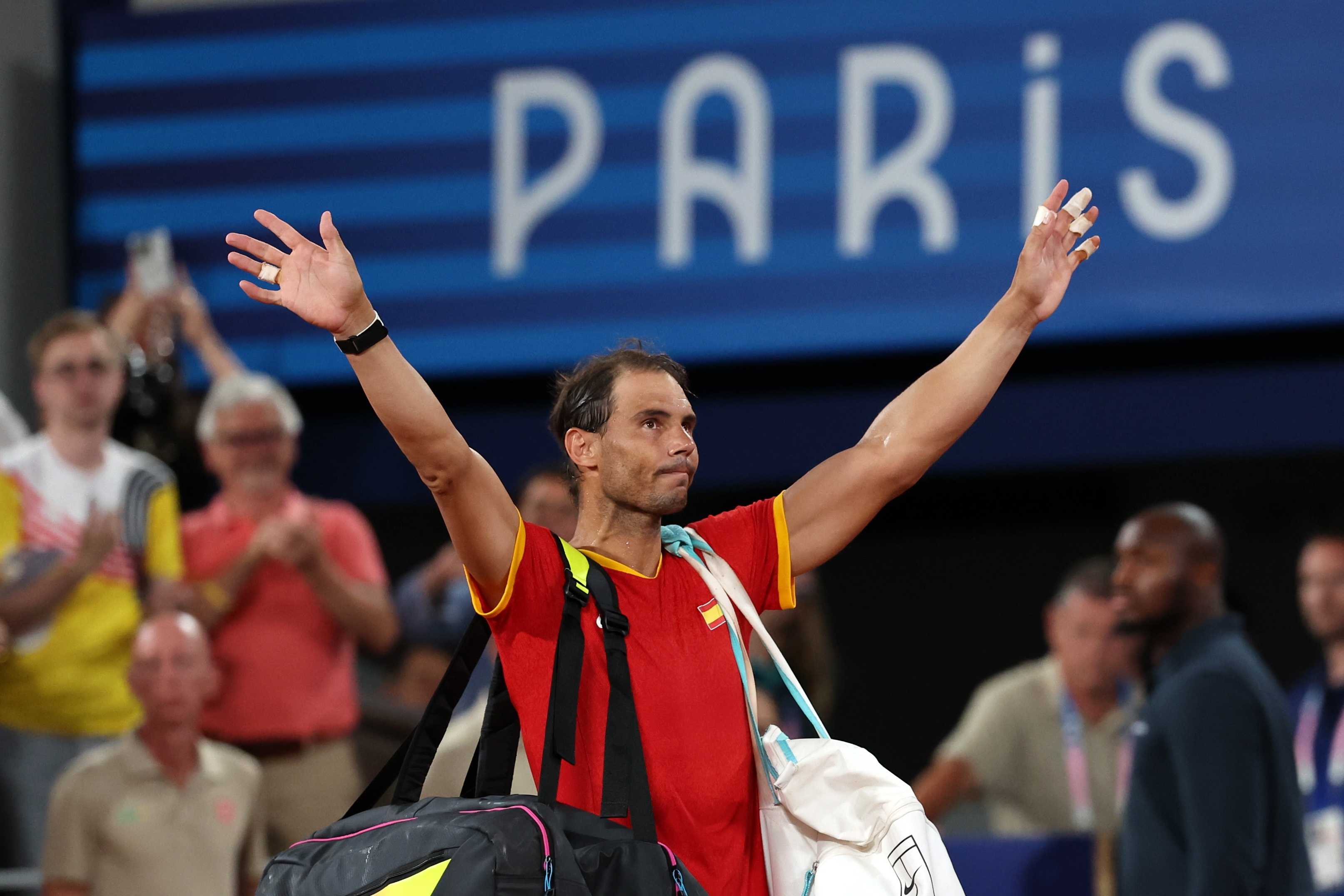 Paris (France), 31/07/2024.- (FILE) - Rafael Nadal of Spain waves to the crowd as he leaves after losing the Men's Doubles Quarter-final match with teammate Carlos Alcaraz against Austin Krajicek and Rajeev Ram of the US at the Tennis competitions in the Paris 2024 Olympic Games, at the Roland Garros in Paris, France, 31 July 2024 (reissued 10 October 2024). On 10 October 2024, Rafael Nadal of Spain announced that he will retire from professional tennis. Since winning his first ever title in 2004, Nadal won 92 titles, including 22 grand slams and a record 14 French Open titles. (Tenis, Abierto, Francia, España) EFE/EPA/Daniel Irungu