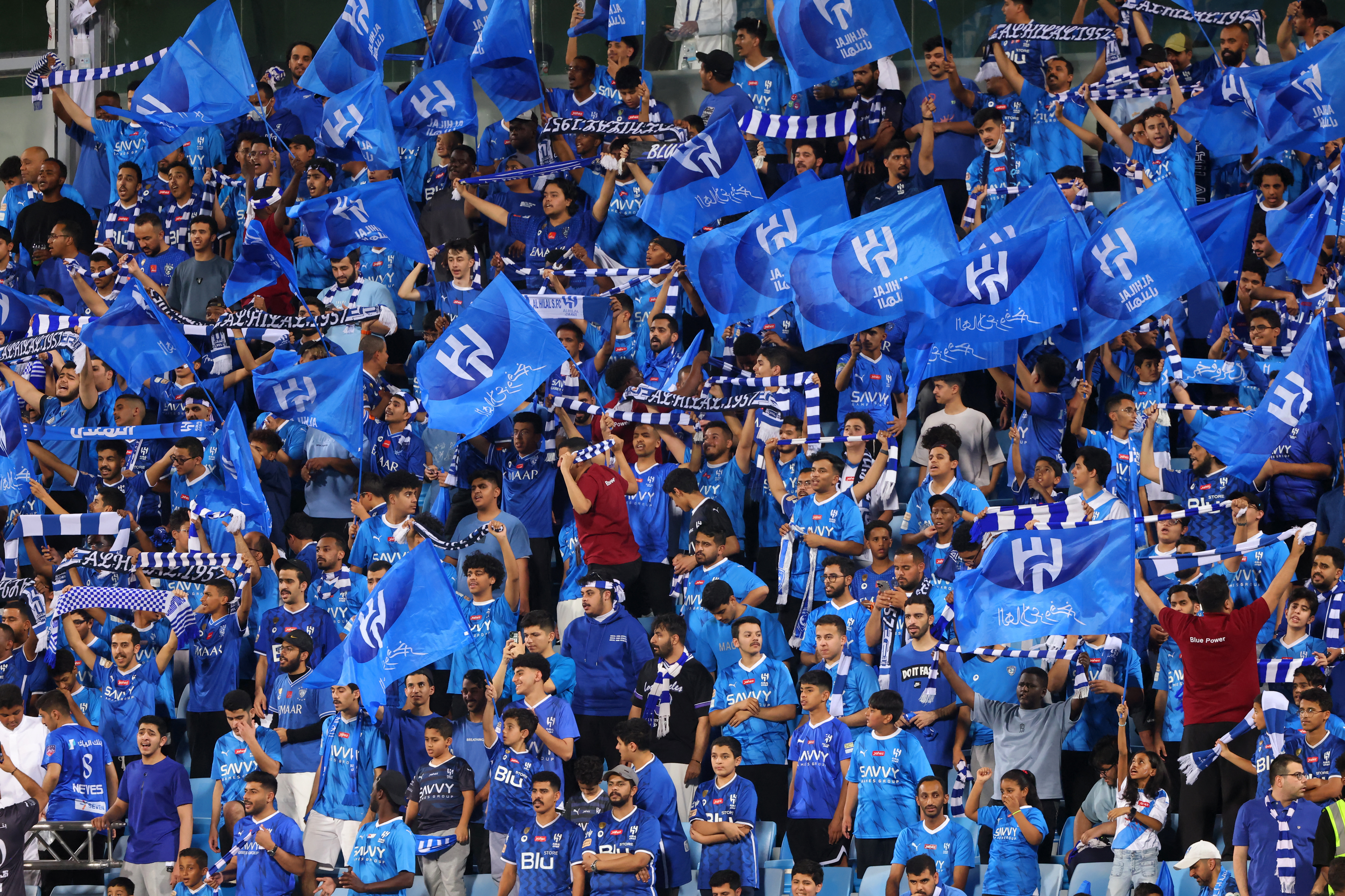 Hilal fans cheer during the Saudi Pro League football match between Al-Hilal and Al-Hazem at the Kingdom Arena stadium in Riyadh on May 11, 2024.