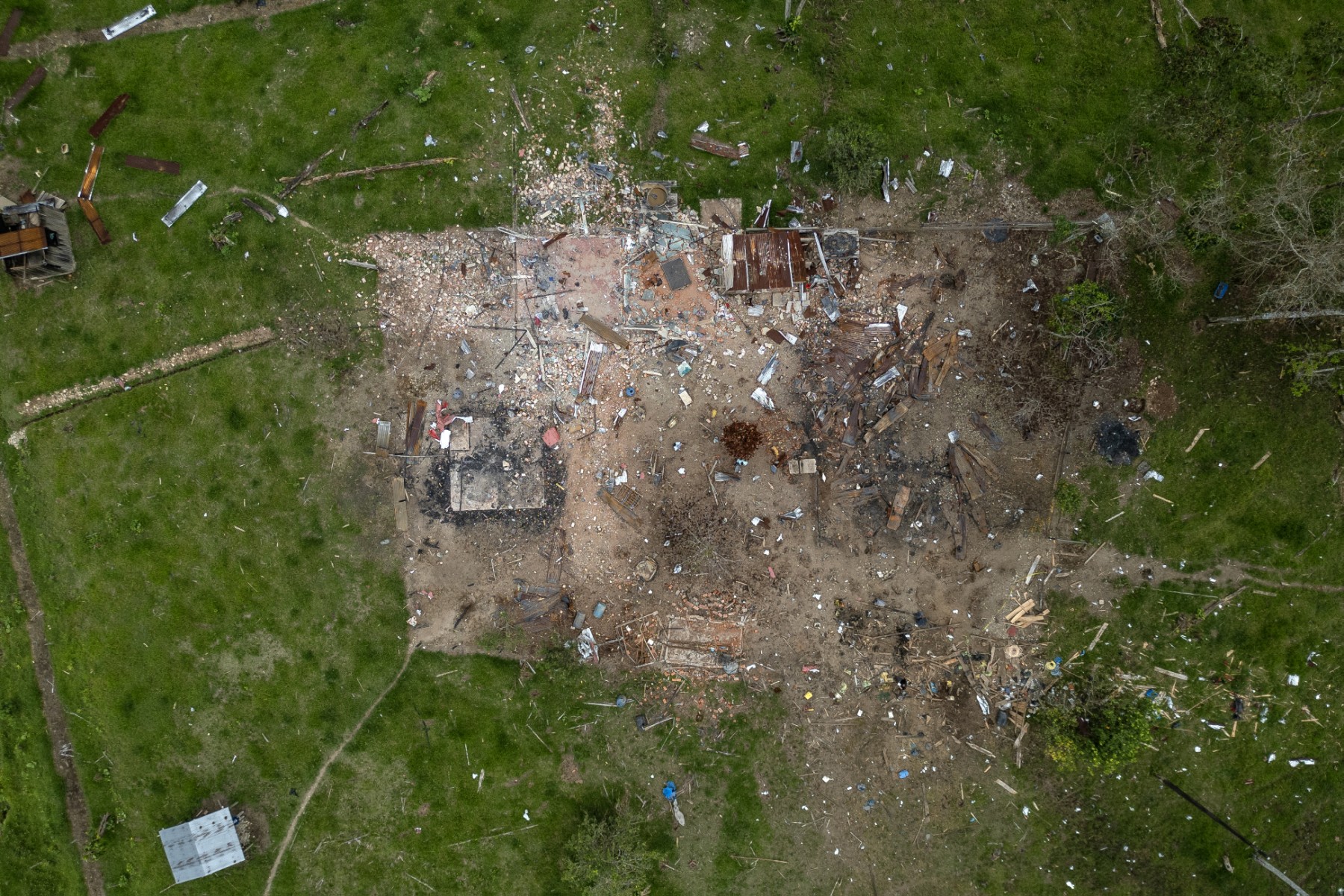 TOPSHOT - Aerial view of damages caused by a bomb dropped by the Ecuadorean army in the Lago Agrio region, Sucumbios province, Ecuador, on the border with Colombia, on March 18, 2025.