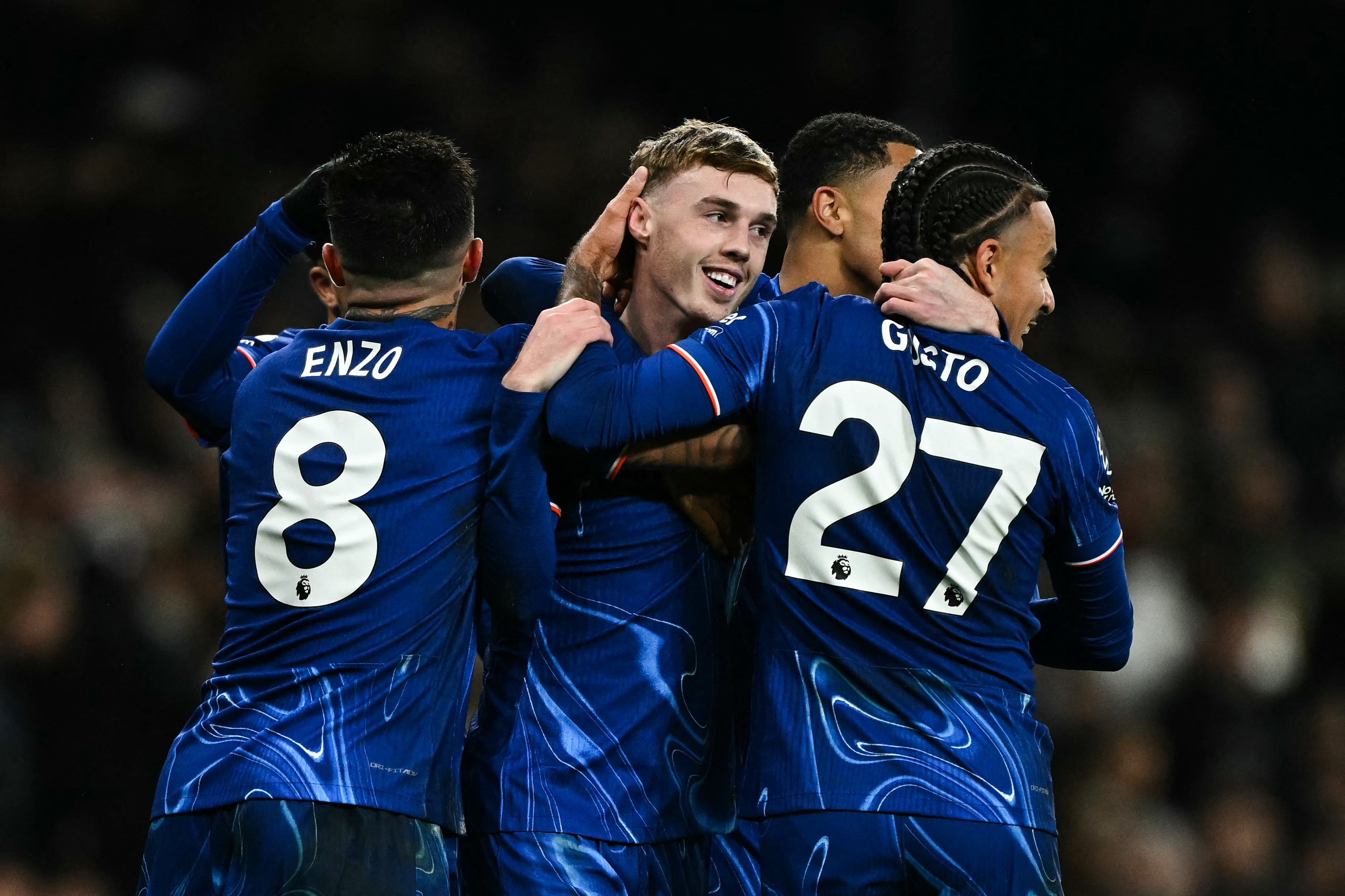 TOPSHOT - Chelsea's English midfielder #20 Cole Palmer (C) celebrates after scoring his team fourth goal during the English Premier League football match between Tottenham Hotspur and Chelsea at the Tottenham Hotspur Stadium in London, on December 8, 2024.