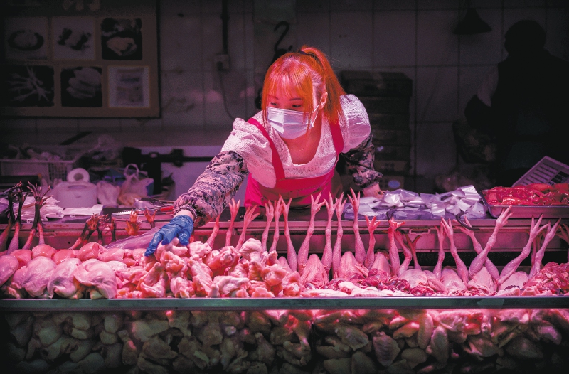 Un vendedor de carne en Beijing, China.