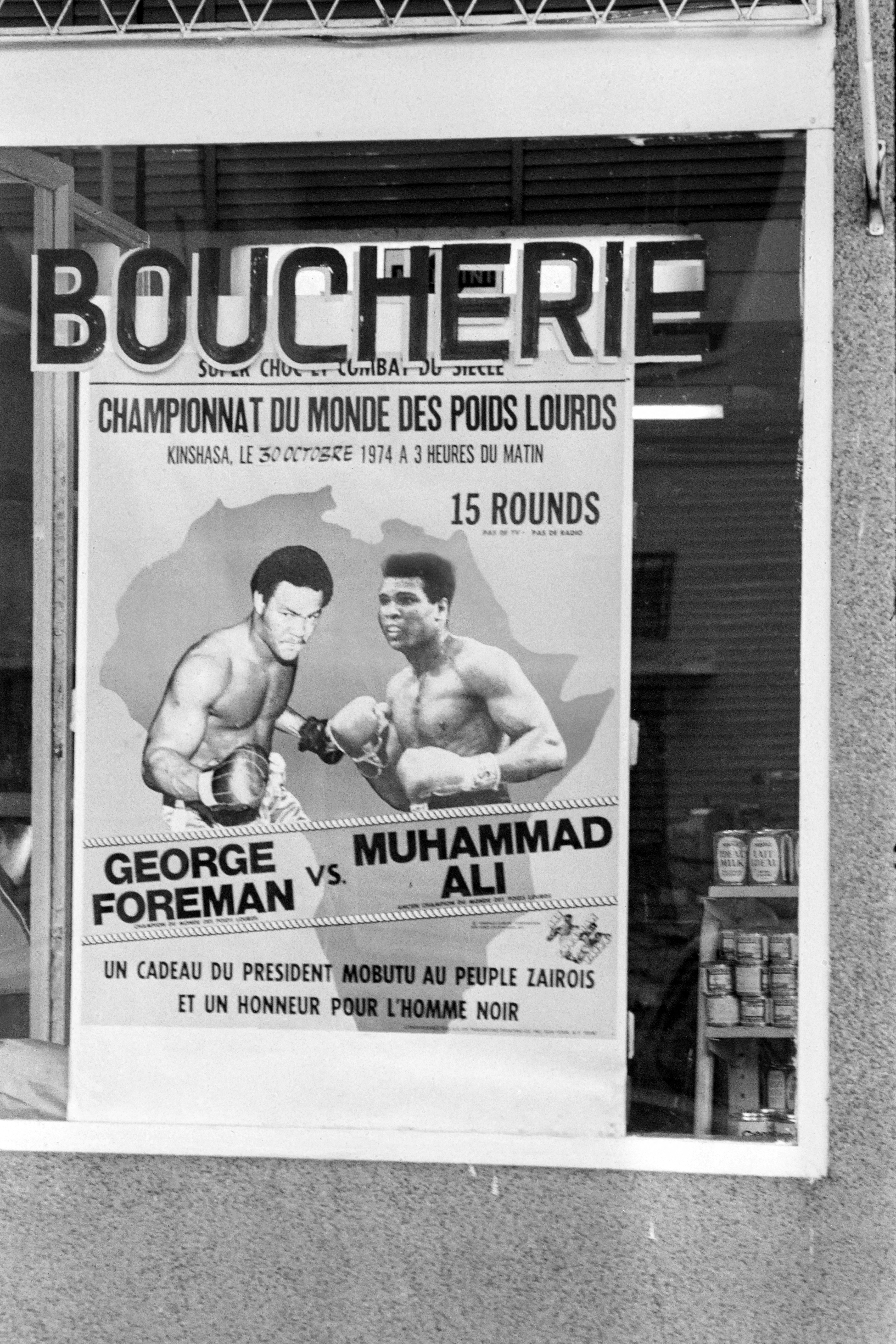 (FILES) A poster is seen on the facade of a butcher's shop in Kinshasa on October 30, 1974 announcing the fight between US boxing heavyweight champions, Muhammad Ali (born Cassius Clay) and George Foreman.