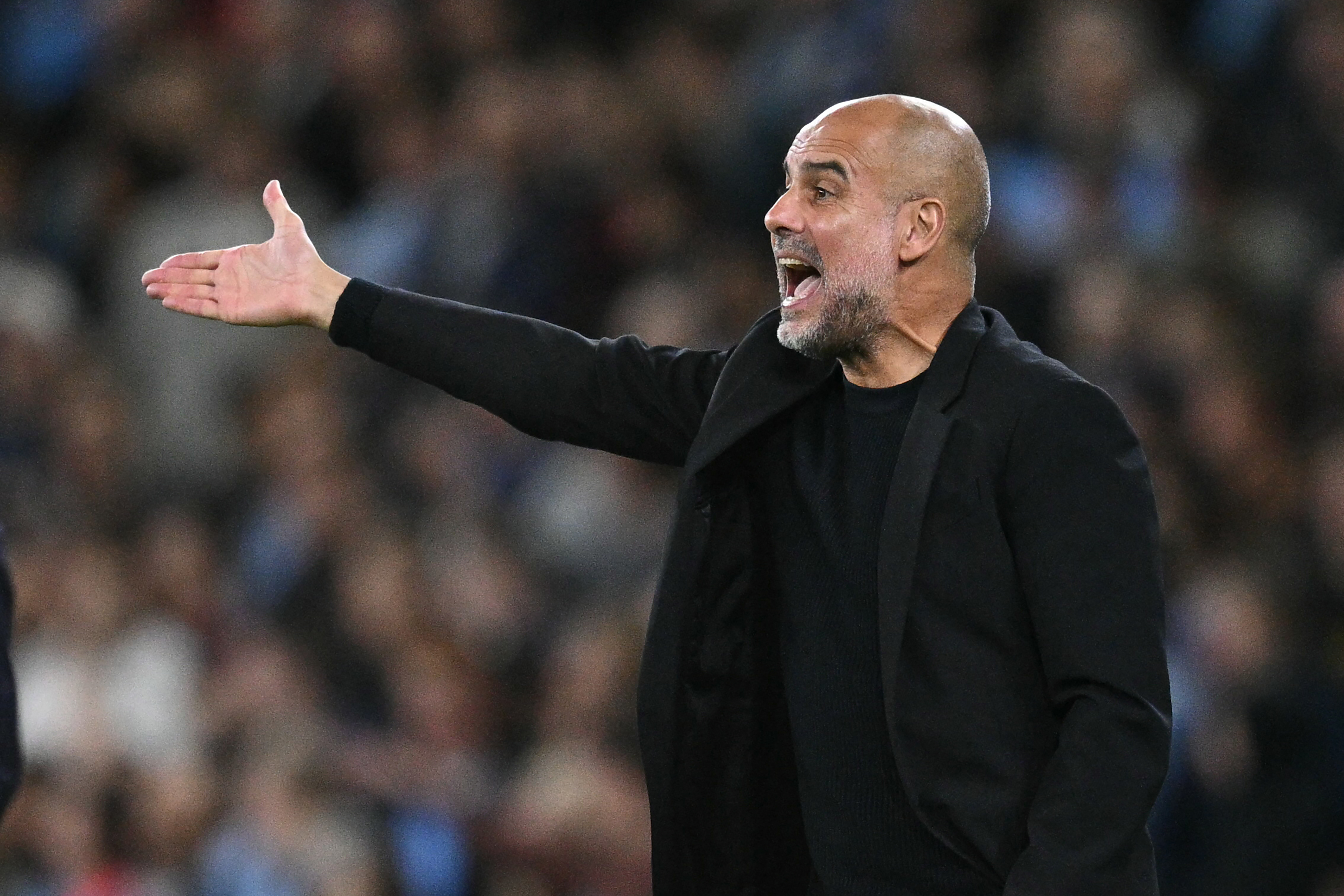 (FILES) Manchester City's Spanish manager Pep Guardiola gestures on the touchline during the UEFA Champions League, league phase football match between Manchester City and Inter Milan at the Etihad stadium, in Manchester, north-west England, on September 18, 2024
