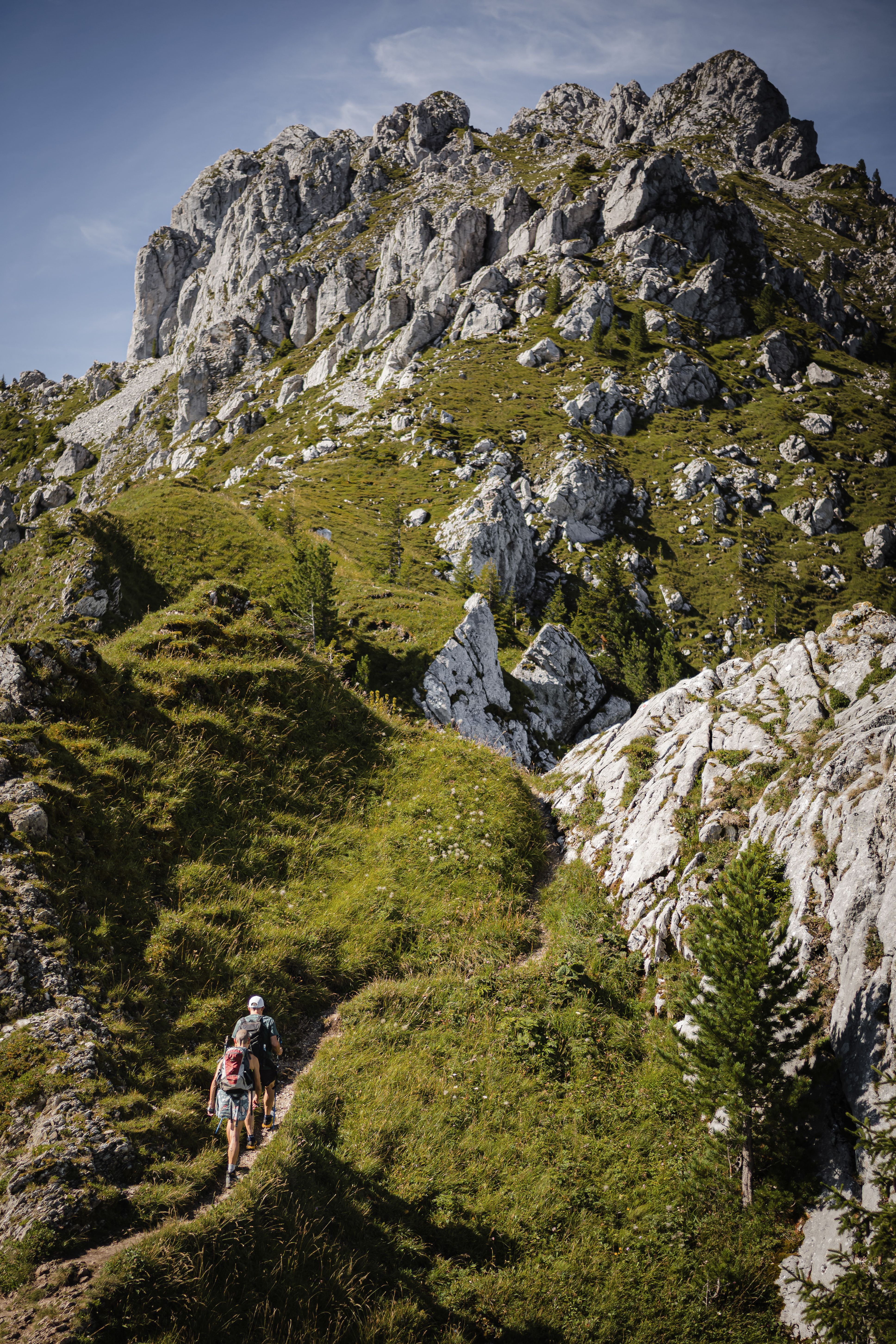 Patrick and Cathy, both 58 years old, walk to the Wandflue peak, Bernese Alps, above Jaun of the Canton of Fribourg, on August 3, 2025.