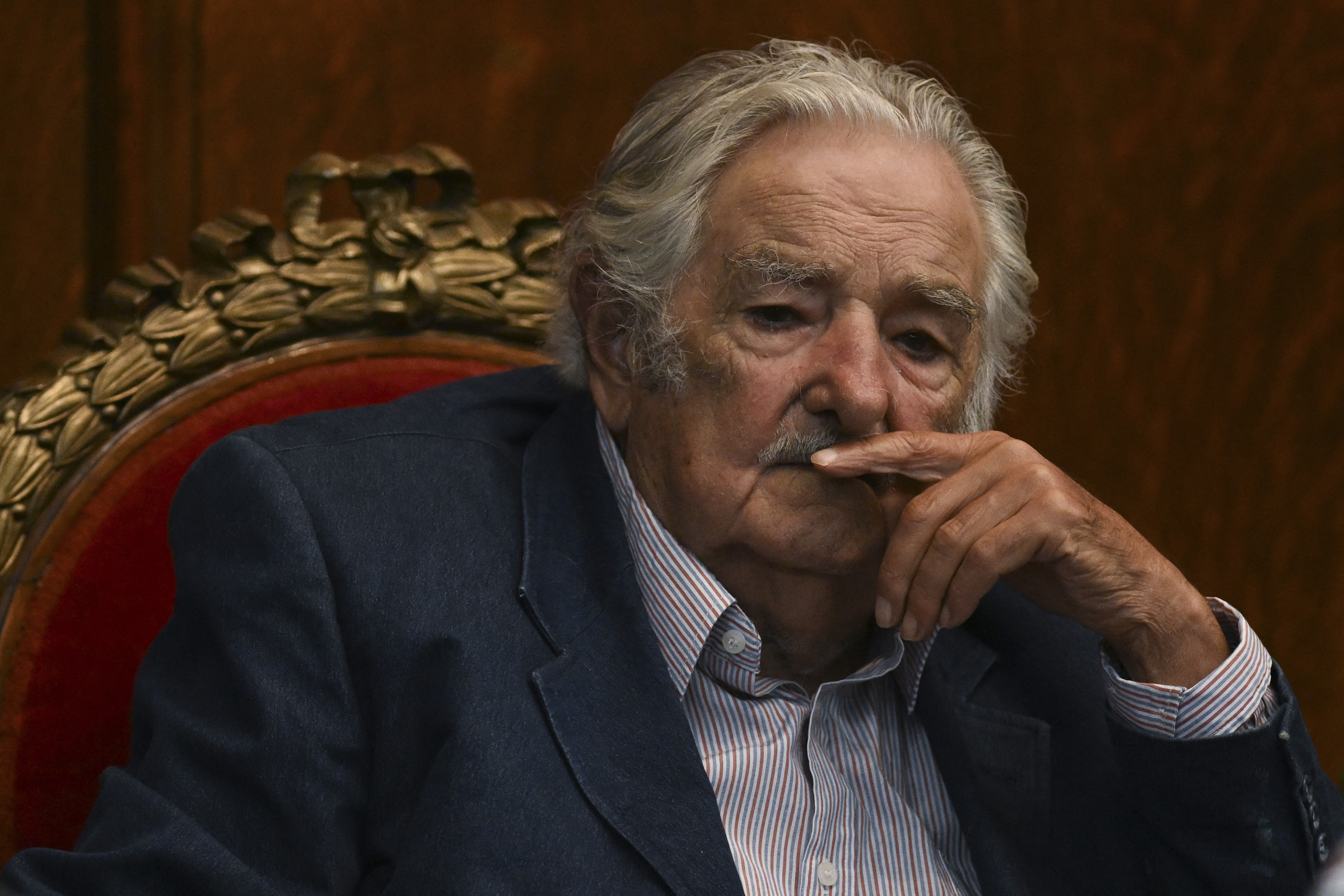 (FILES) Uruguayan former President Jose Mujica gestures during a ceremony where he was honored for his contribution to the Colombian peace process in Montevideo on February 16, 2023.