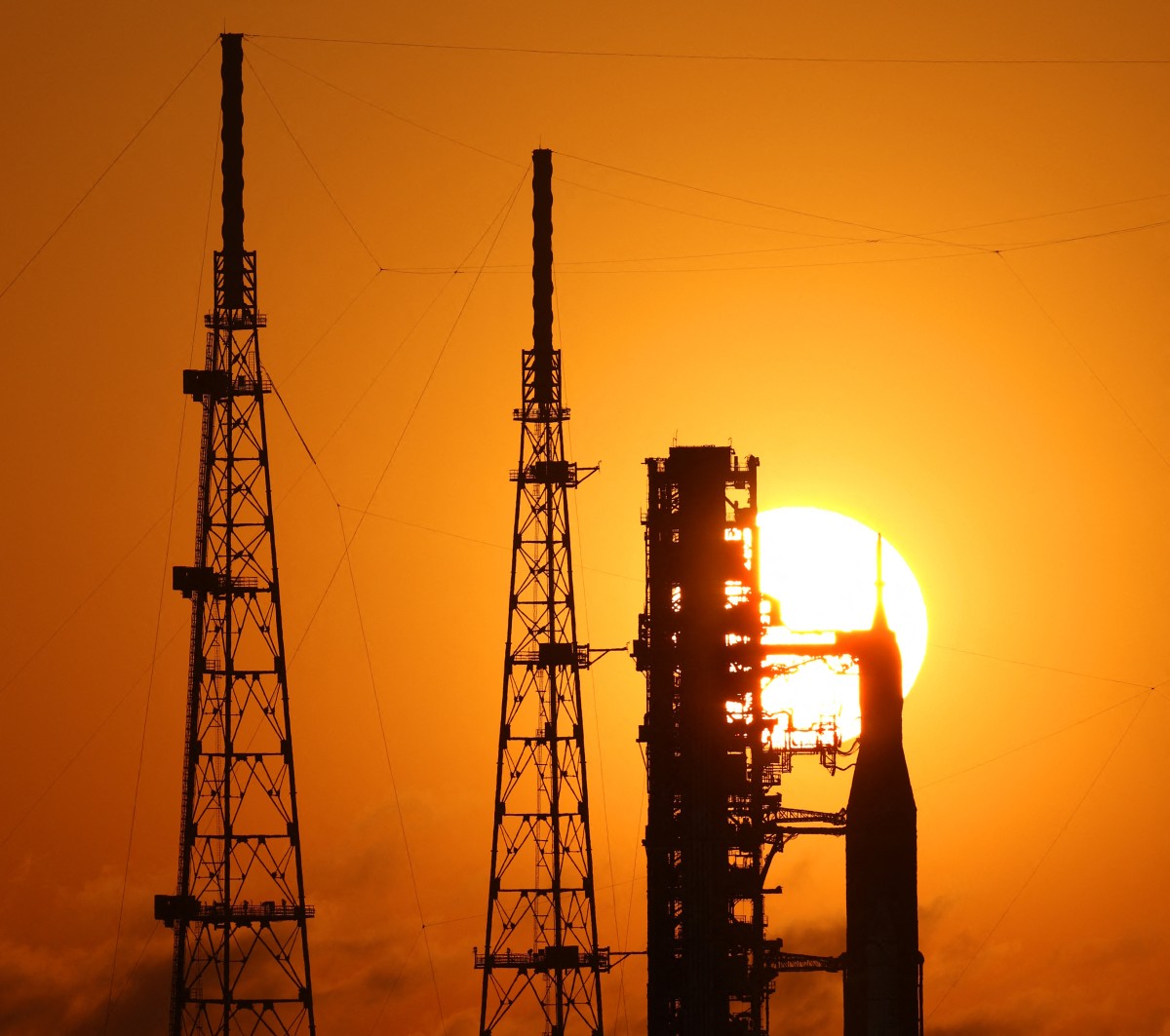 NASA's Artemis II Space Launch System (SLS) rocket and Orion spacecraft are seen at sunrise at Launch Pad 39B at the Kennedy Space Center in Cape Canaveral, Florida on March 24, 2026.