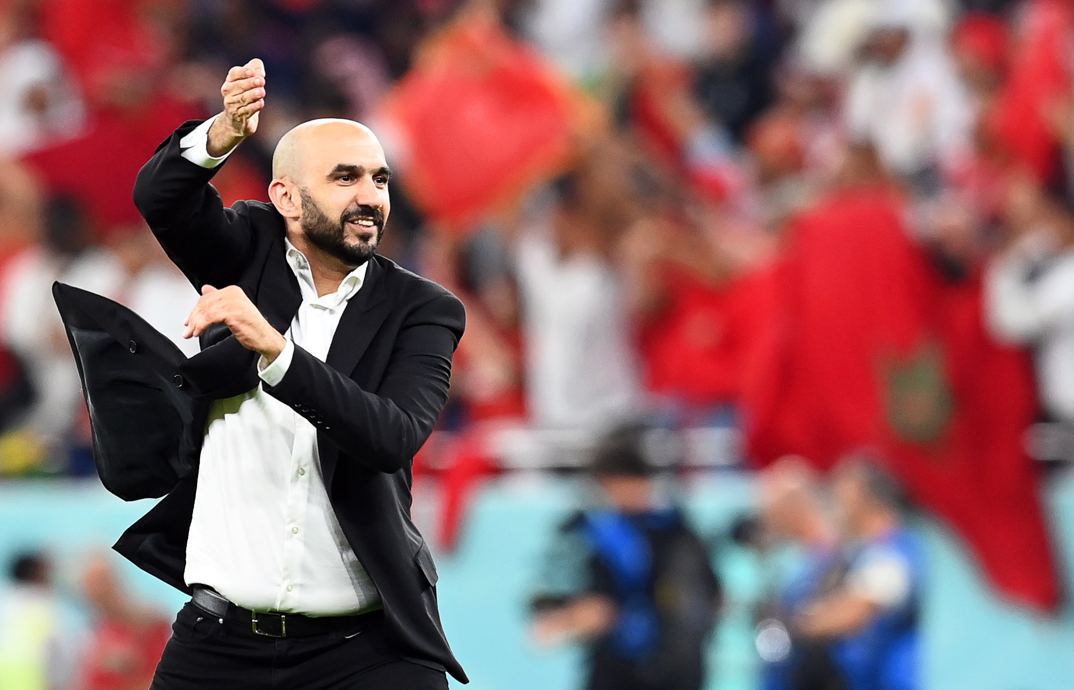 Doha (Qatar), 10/12/2022.- Morocco's head coach Walid Regragui celebrates after winning the FIFA World Cup 2022 quarter final soccer match between Morocco and Portugal at Al Thumama Stadium in Doha, Qatar, 10 December 2022. (Mundial de Fútbol, Marruecos, Catar) EFE/EPA/Georgi Licovski