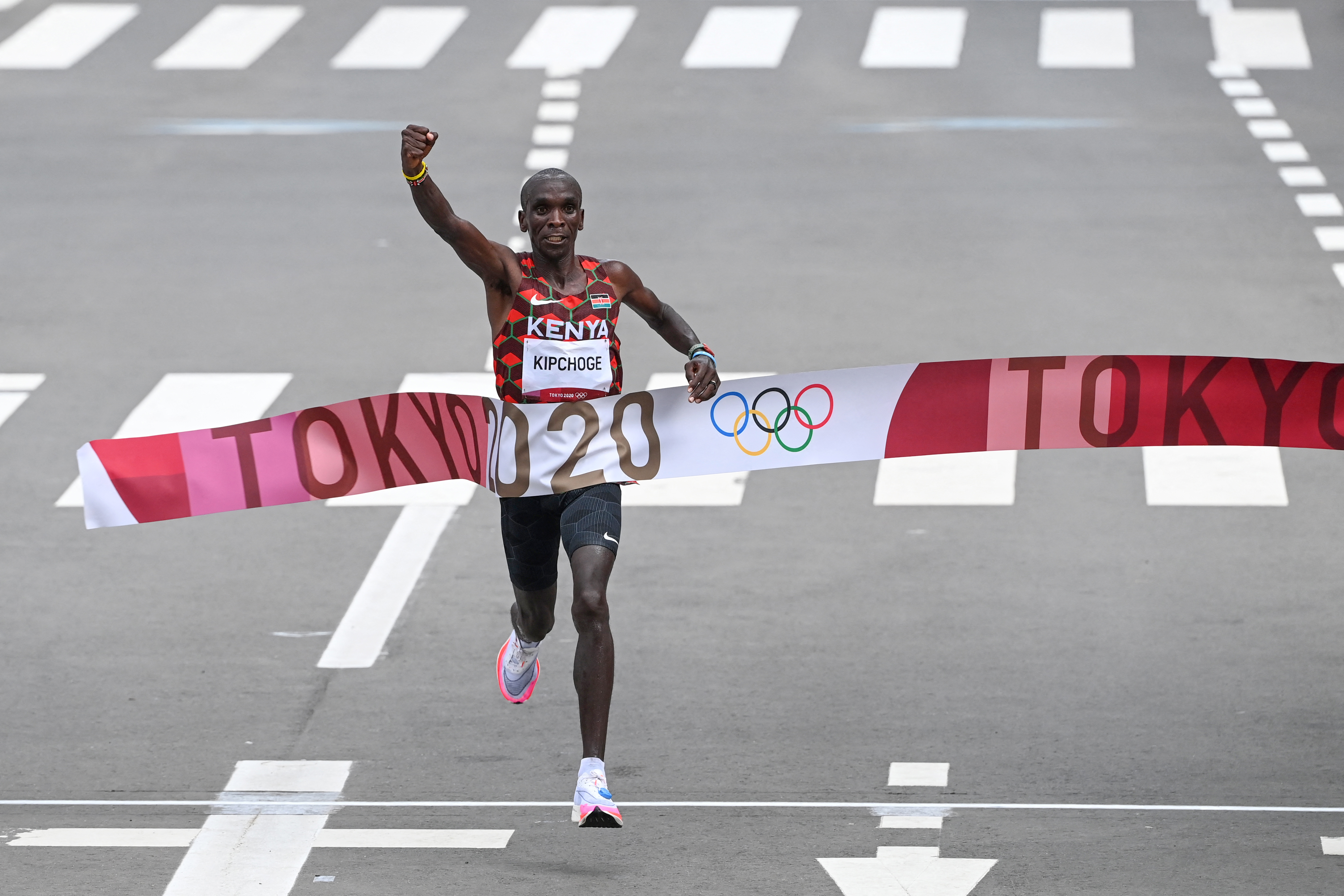 (FILES) Kenya's Eliud Kipchoge crosses the finish line to win the men's marathon final during the Tokyo 2020 Olympic Games in Sapporo on August 8, 2021.