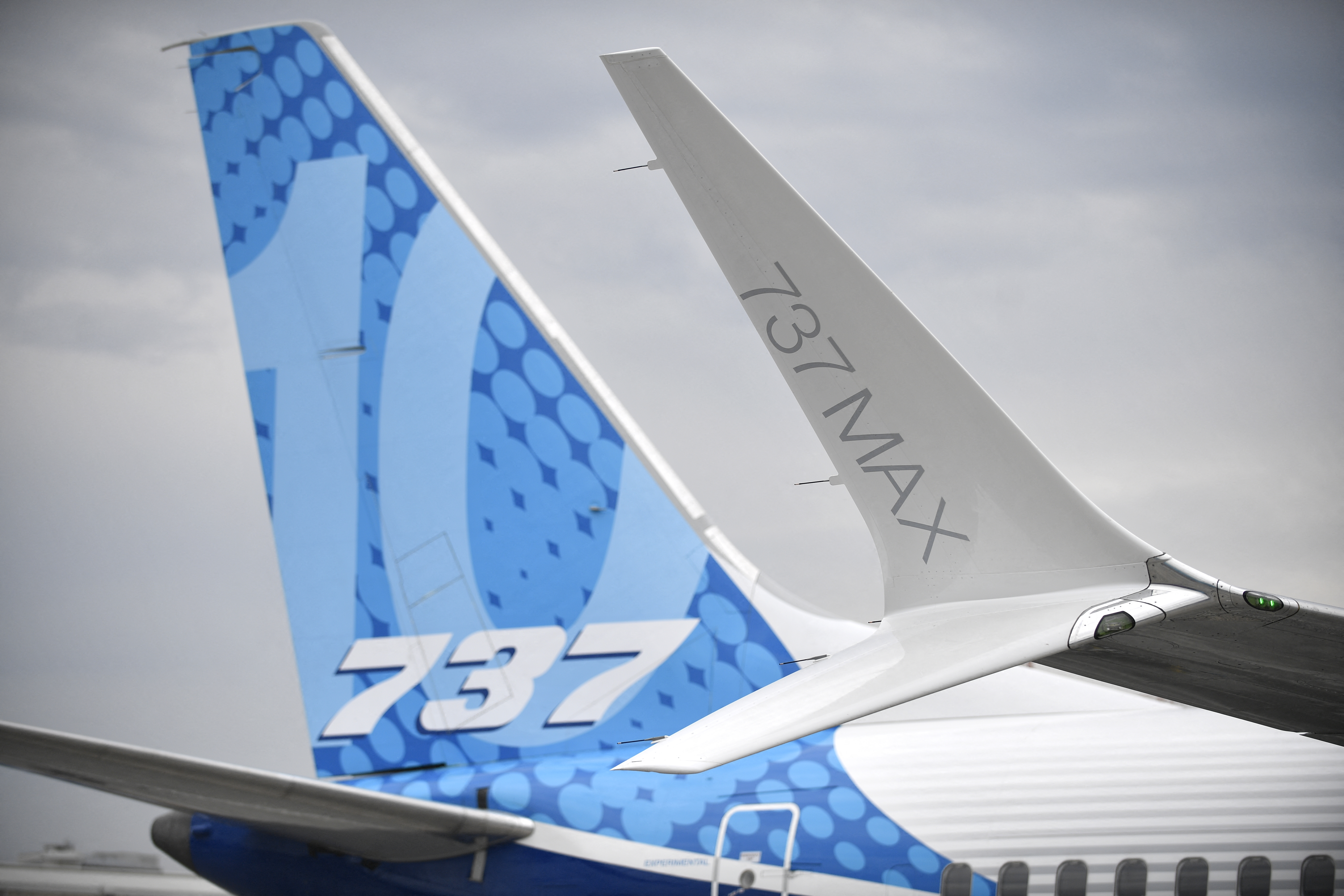 (FILES) This photograph taken on June 18, 2023 shows the Boeing 737 tail fin and a Boeing 737 Max winglet (R) during the International Paris Air Show at the Paris–Le Bourget Airport.