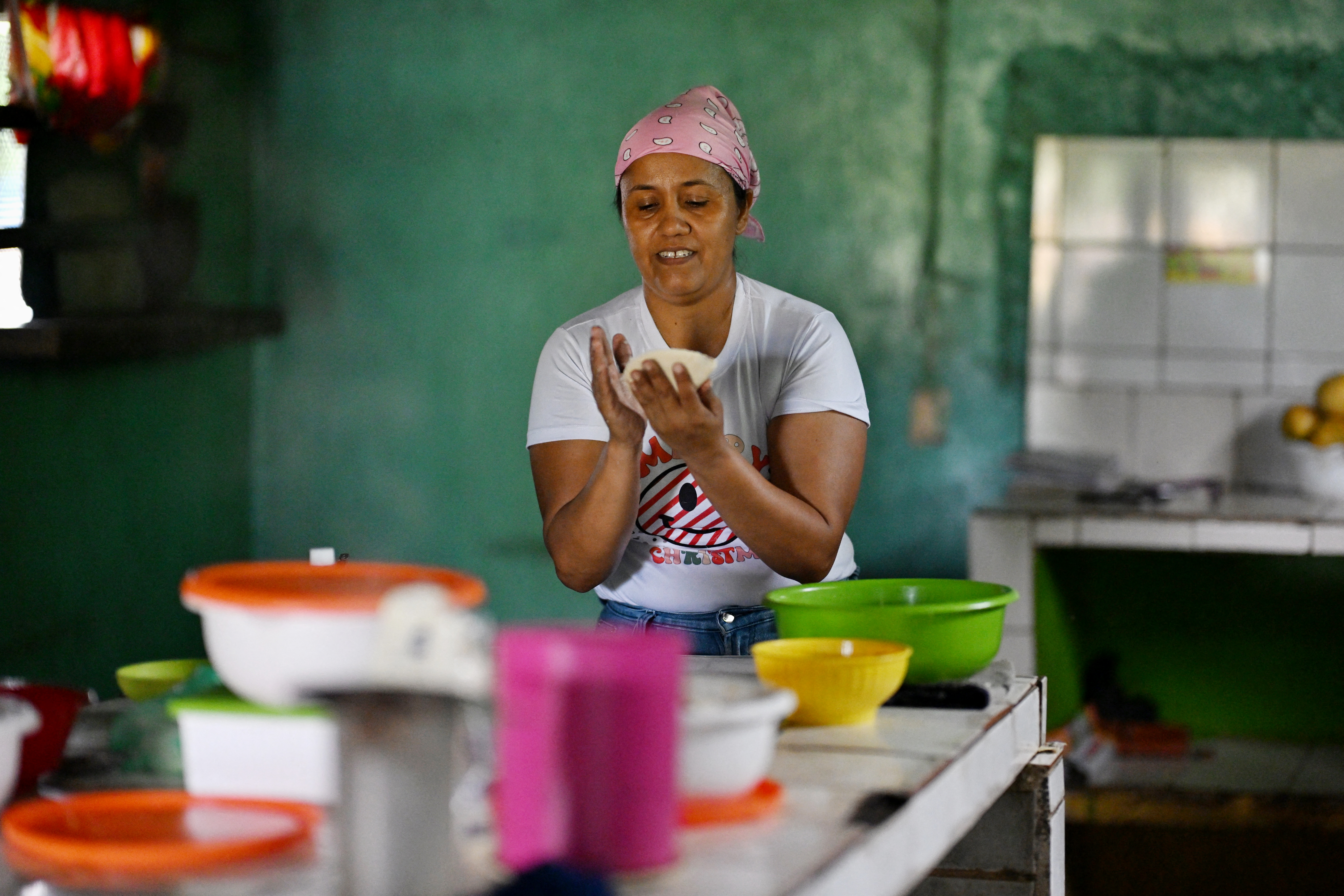 Corina Hernandez worked in the kitchen preparing empanadas at her restaurant in Corozopando village, Guarico State, Venezuela, on May 30, 2024.
