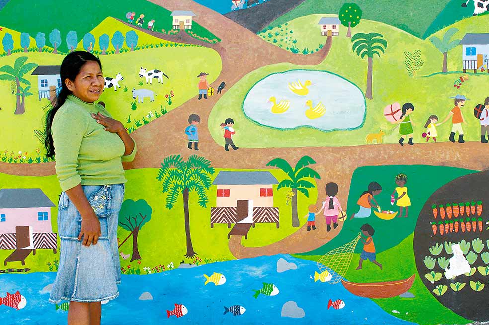 Licinia Collazos, exgobernadora del resguardo. Mural símbolo de memoria pintado por los niños, es su proyecto de vida.