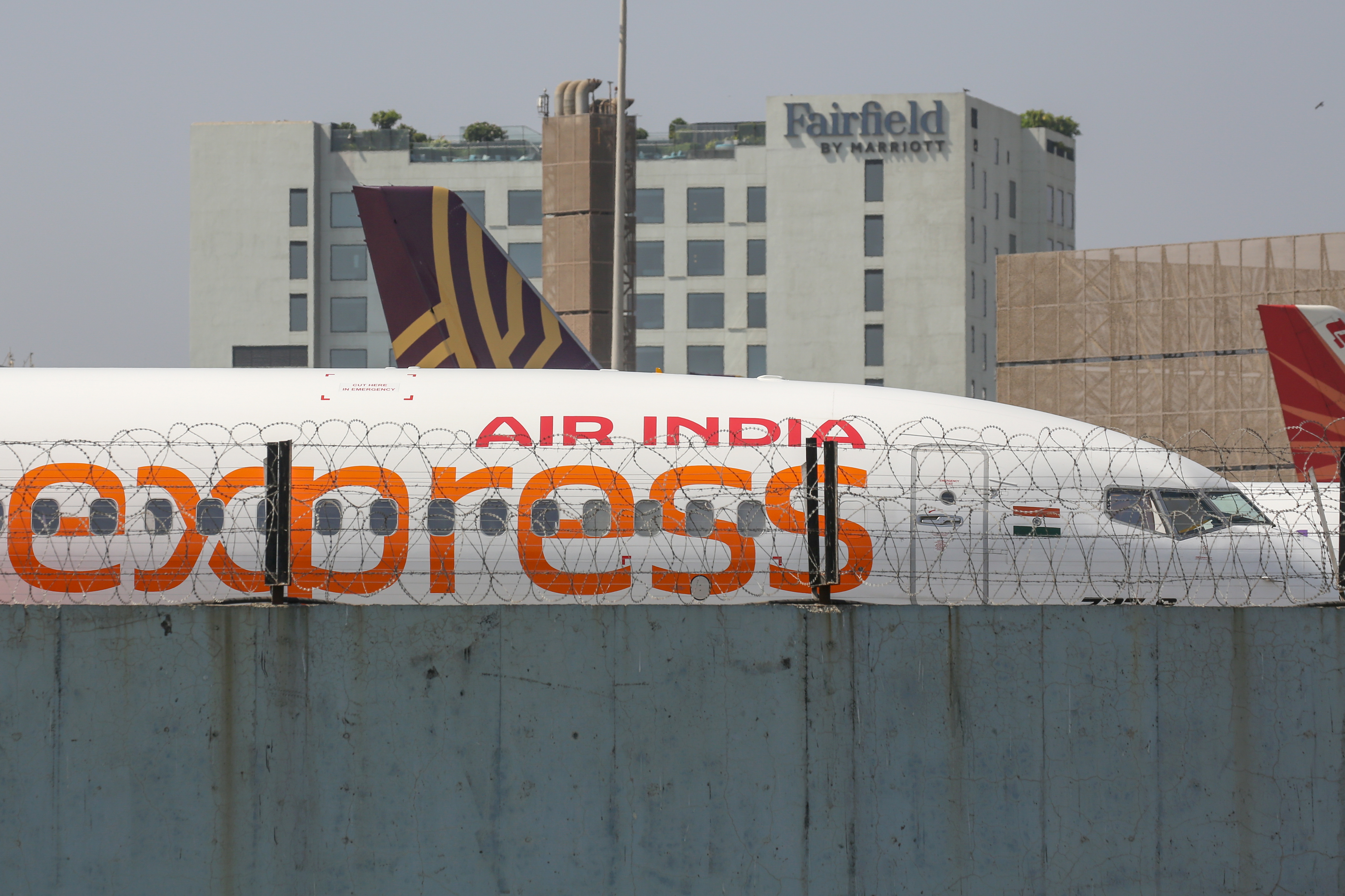 Mumbai (India), 08/05/2024.- An Air India Express passenger plane parked at Chhatrapati Shivaji International Airport in Mumbai, India, 09 May 2024. Air India Express, a subsidiary of Air India owned by the Tata Group, cancelled over 85 flights after nearly 300 employees of the airline went on mass sick leave and switched off their mobile phones on 08 May, leading to large-scale flight disruptions. EFE/EPA/DIVYAKANT SOLANKI