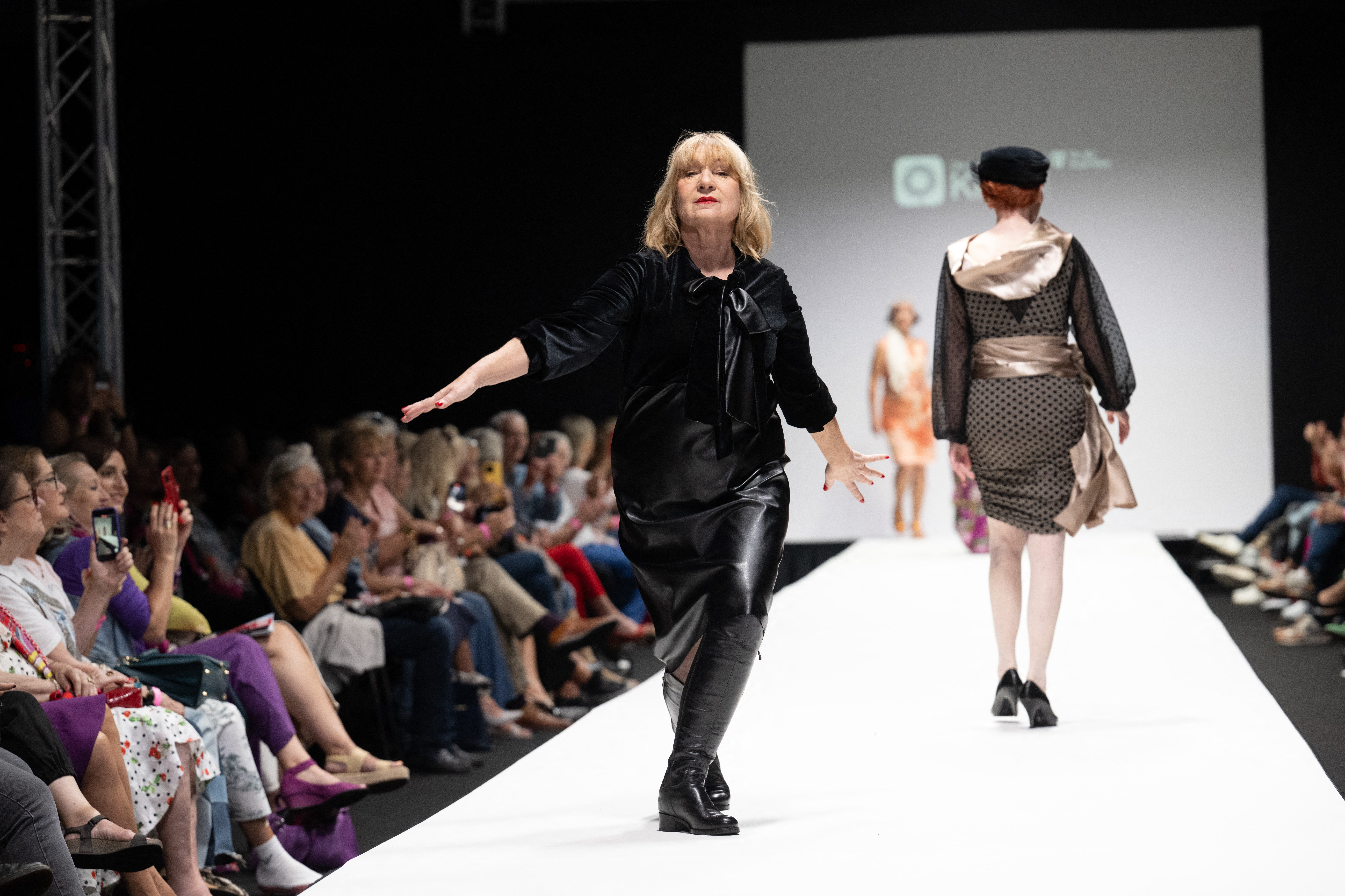 Members of a group of retired people present their own line of upcycled clothes the Vienna Fashion week at the Museum Quartier in Vienna, Austria on September 10, 2023.