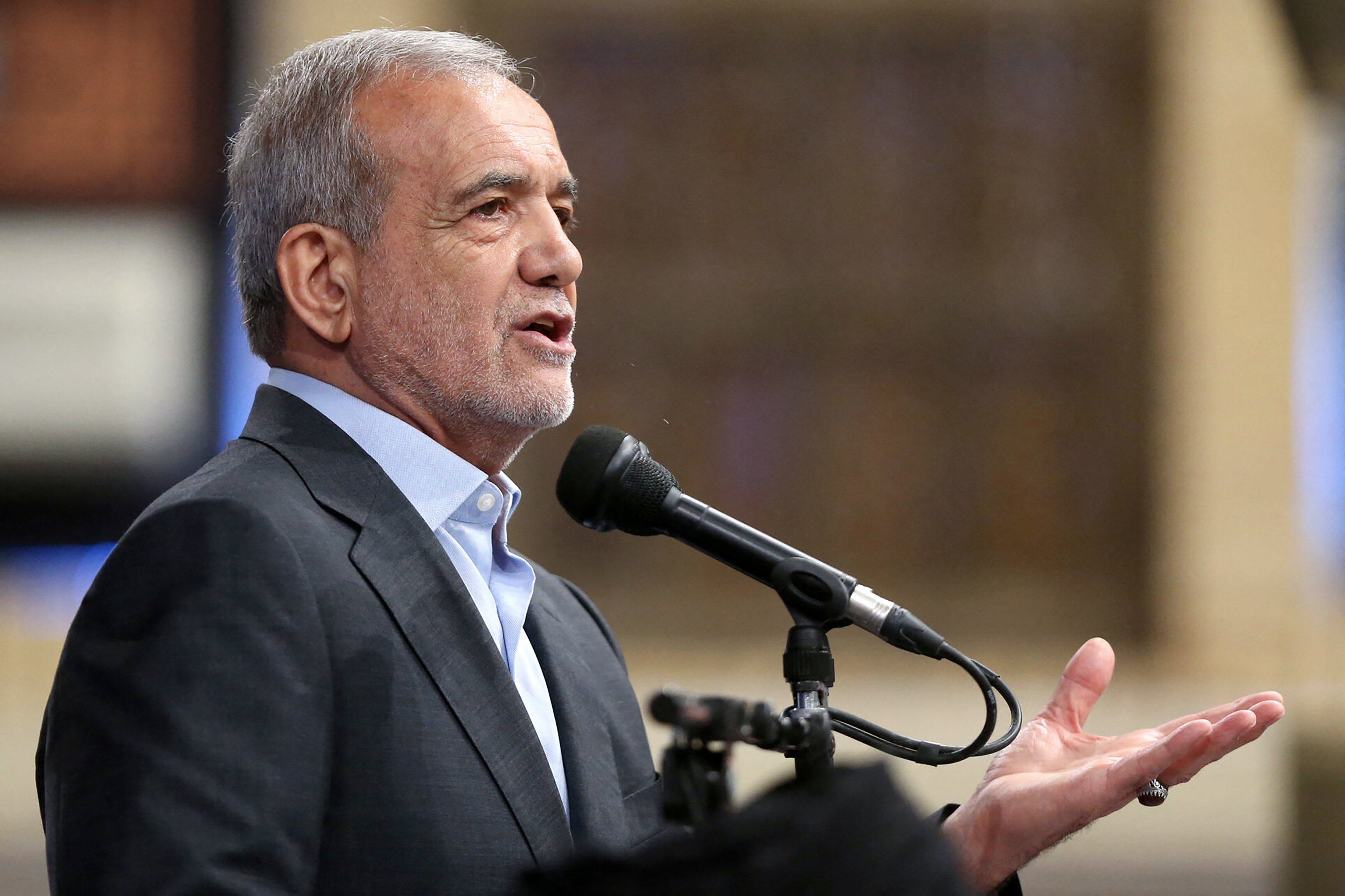 A handout picture provided by the office of Iran's Supreme Leader Ayatollah Ali Khamenei on July 28, 2024, shows President-elect Masoud Pezeshkian delivering a speech during the official presidential endorsement ceremony by Iran's Supreme Leader.