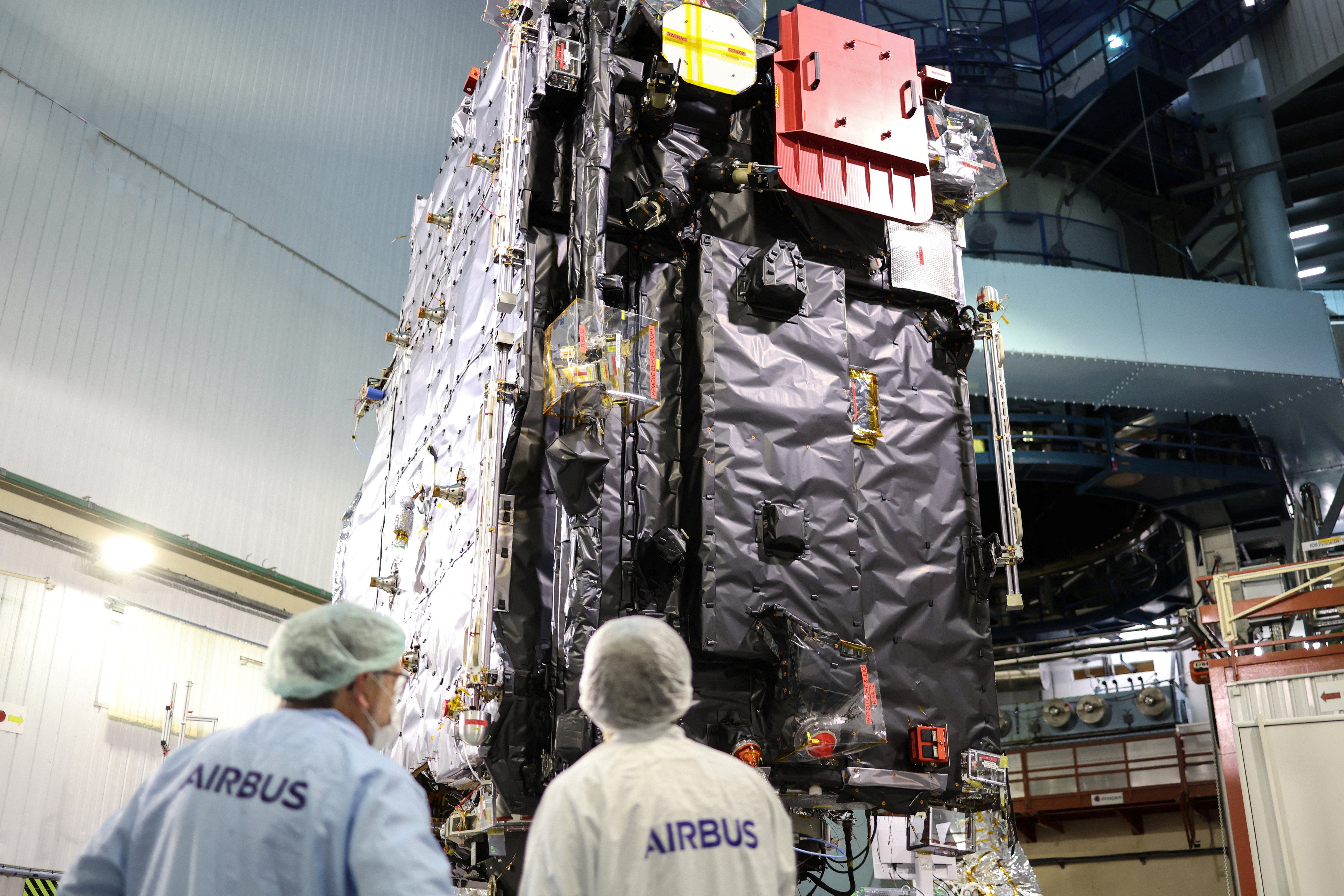 (FILES) Engineers work around the ESA's (European Space Agency) "Juice" probe during its unveiling for media in Toulouse, southwestern France on January 20, 2023, a few days ahead of its departure to Kourou space center.