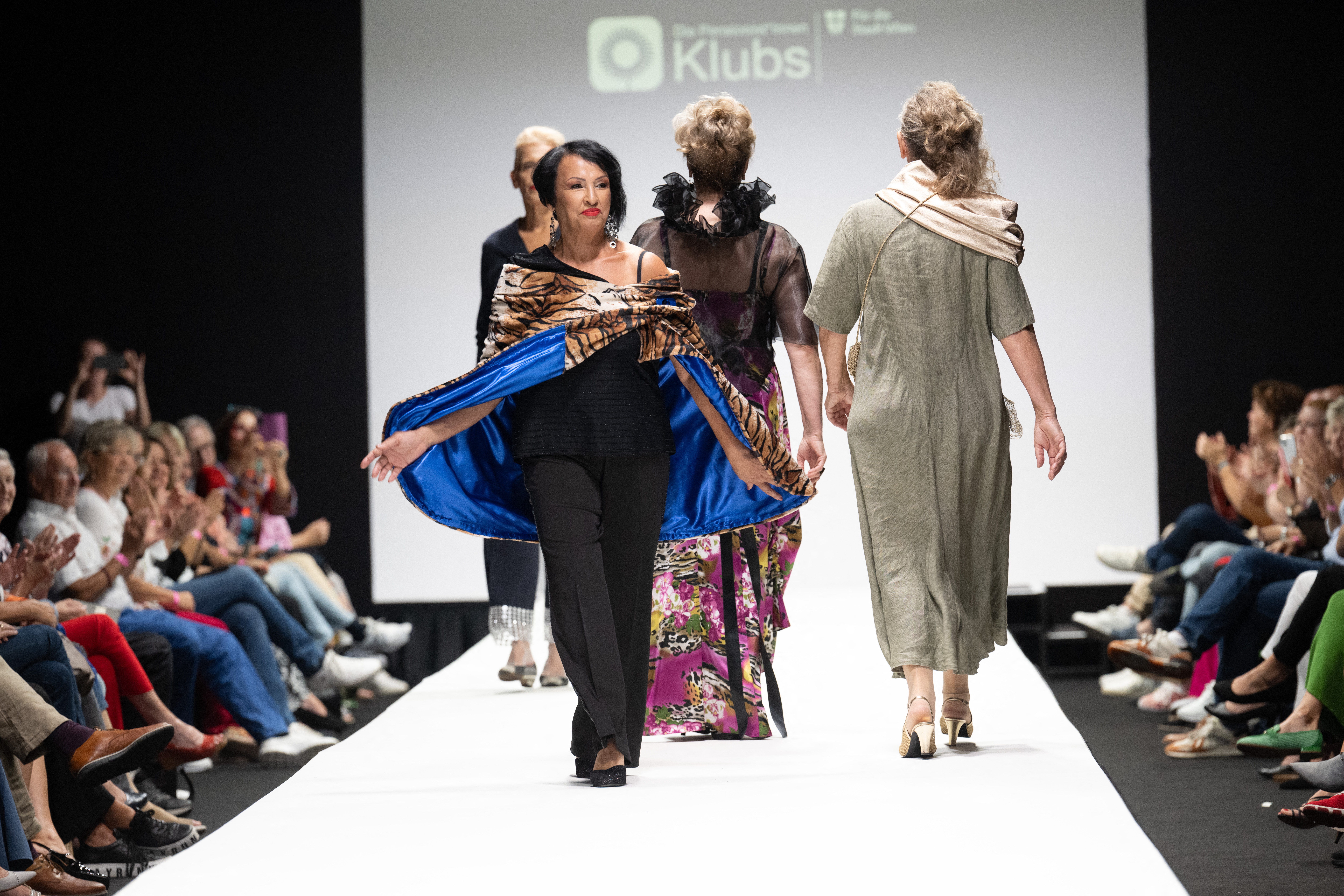 Members of a group of retired people present their own line of upcycled clothes the Vienna Fashion week at the Museum Quartier in Vienna, Austria on September 10, 2023.
