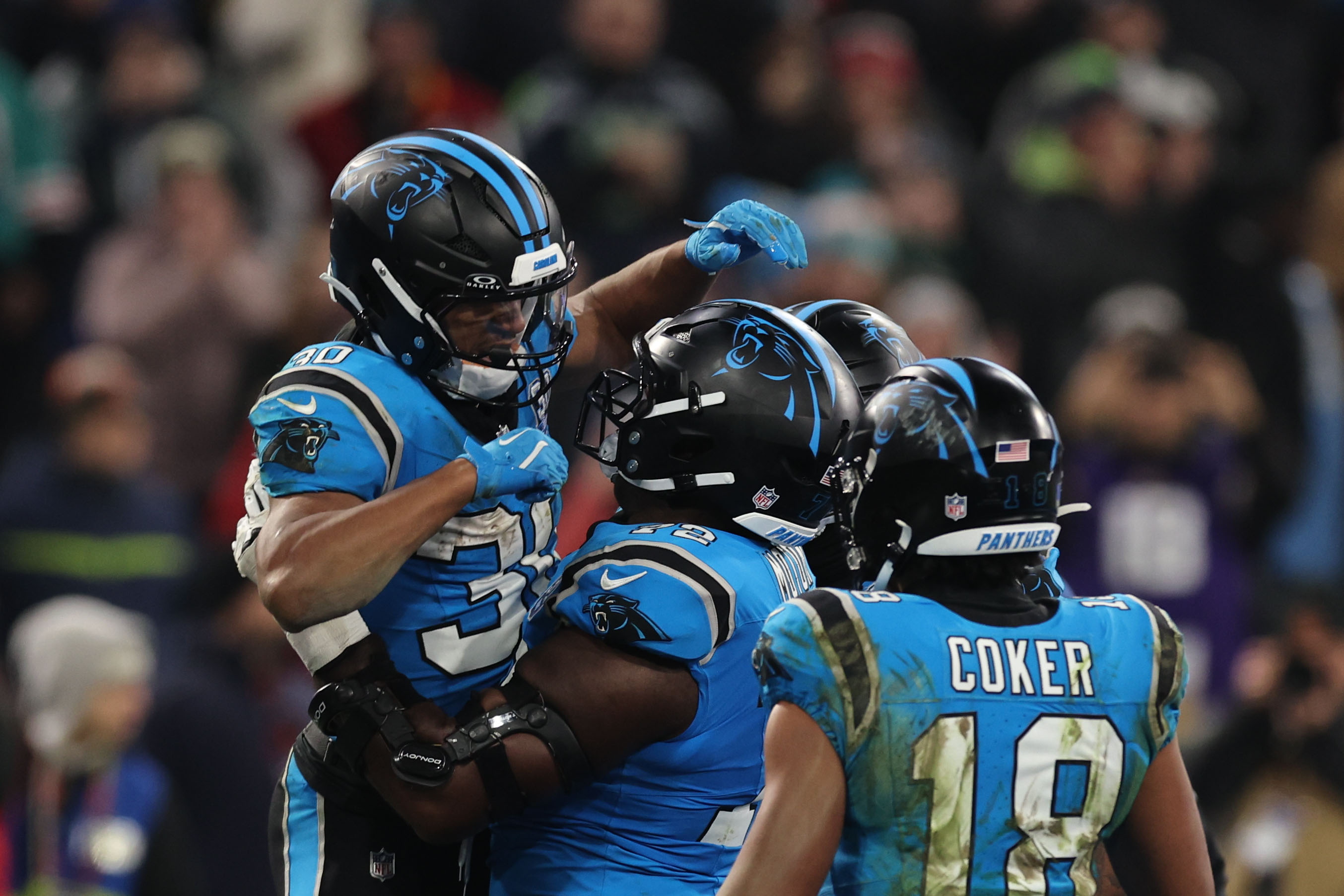 Munich (Germany), 10/11/2024.- Carolina Panthers Running Back Chuba Hubbard (L) celebrates with teammates after scoring a touch down during the NFL game between New York Giants and Carolina Panthers in Munich, Germany, 10 November 2024. (Alemania, Nueva York) EFE/EPA/ANNA SZILAGYI