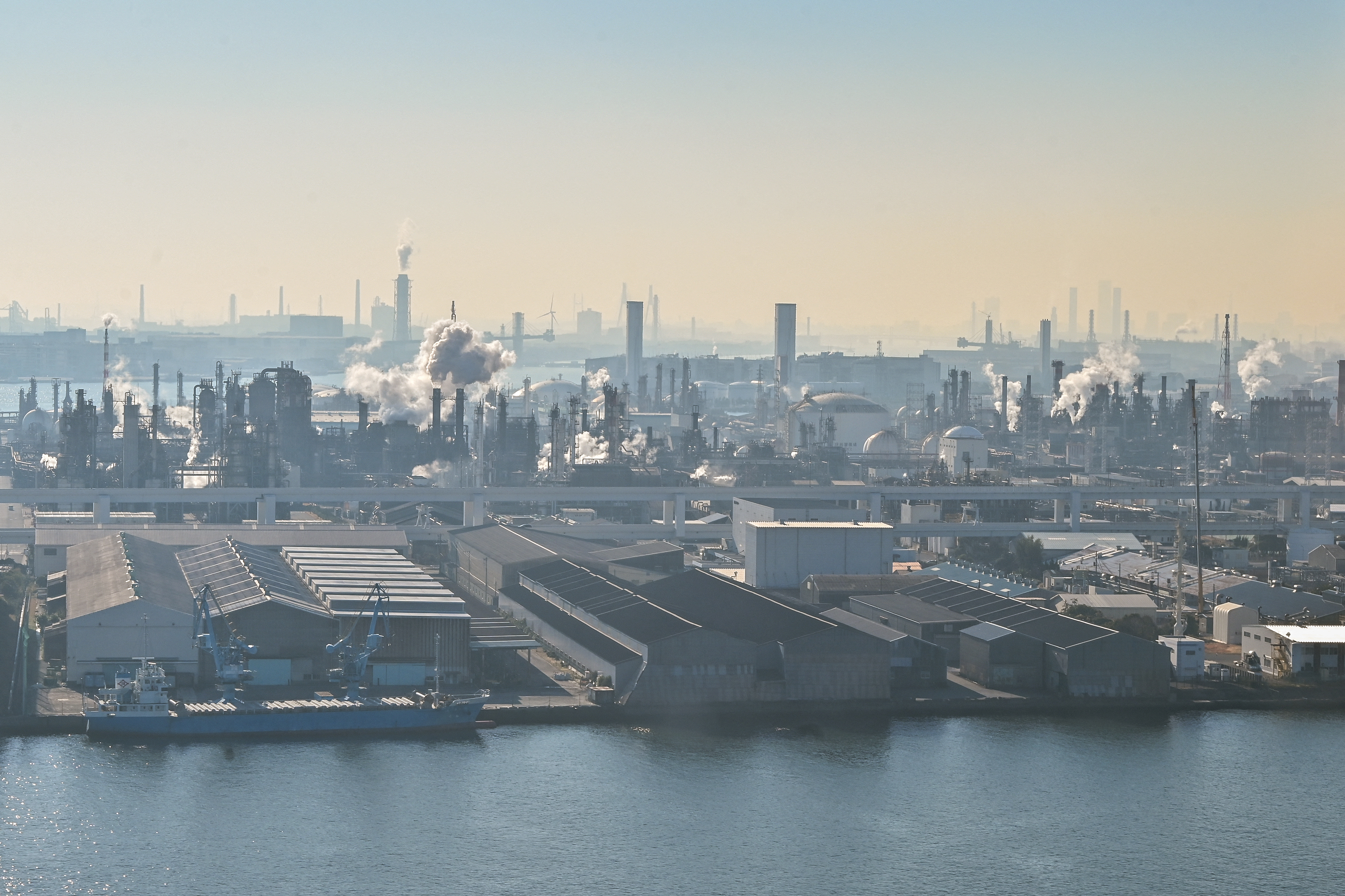 (FILES) This photo taken on December 29, 2023 shows the industrial area of Ukishima-cho in the city of Kawasaki, Kanagawa prefecture, across the water from Tokyo International Airport at Haneda.
