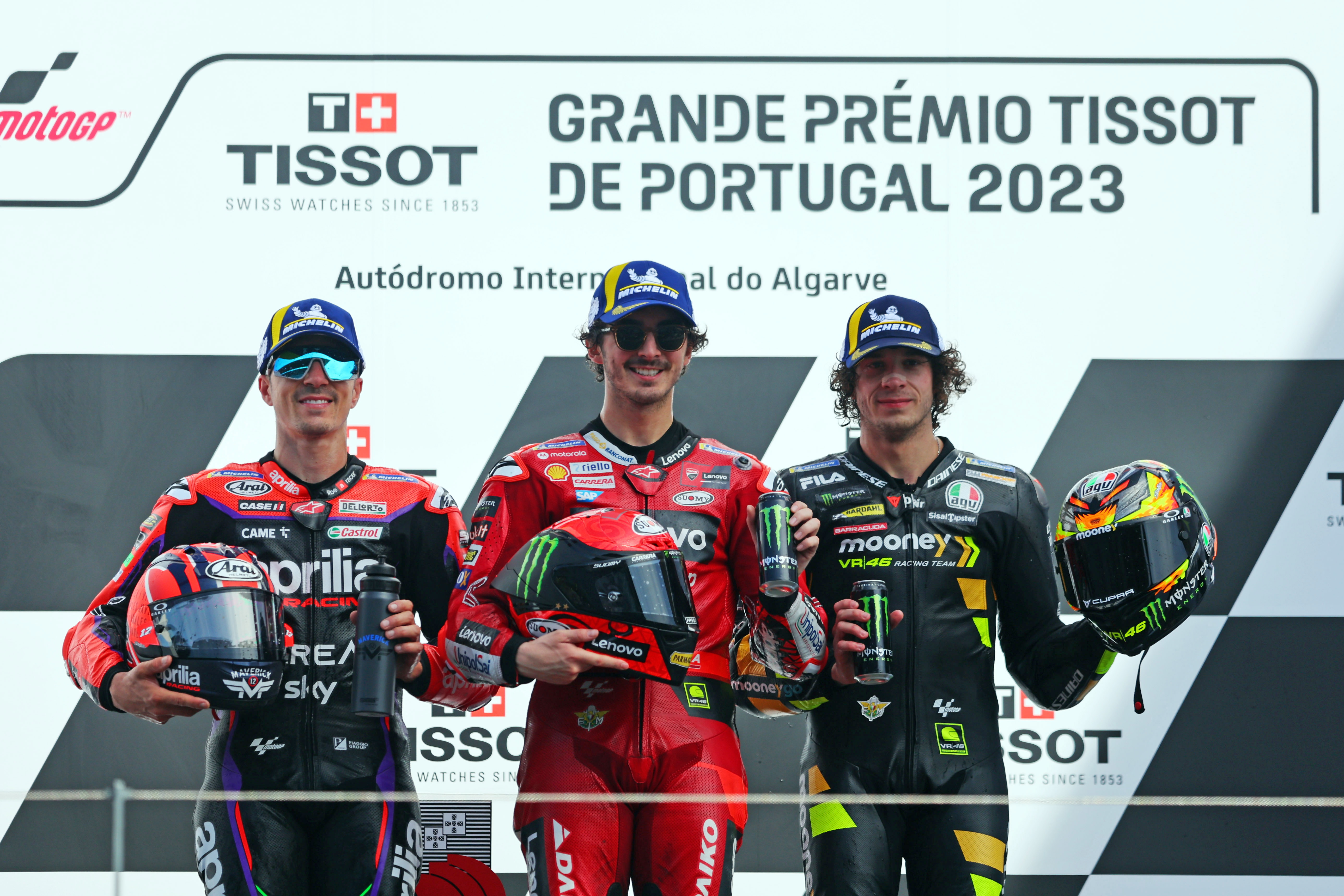 Portimao (Portugal), 26/03/2023.- Italian MotoGP rider Francesco Bagnaia (C) of Ducati Lenovo Team, Spanish MotoGP rider Maverick Vinales (L) of Aprilia Racing and Italian MotoGP rider Marco Bezzecchi of Mooney VR46 Racing Team celebrate on the podium after the MotoGP race at the Motorcycle Grand Prix of Portugal at Algarve International race track, Portimao, Portugal, 26 March 2023. (Motociclismo, Ciclismo, Francia) EFE/EPA/NUNO VEIGA