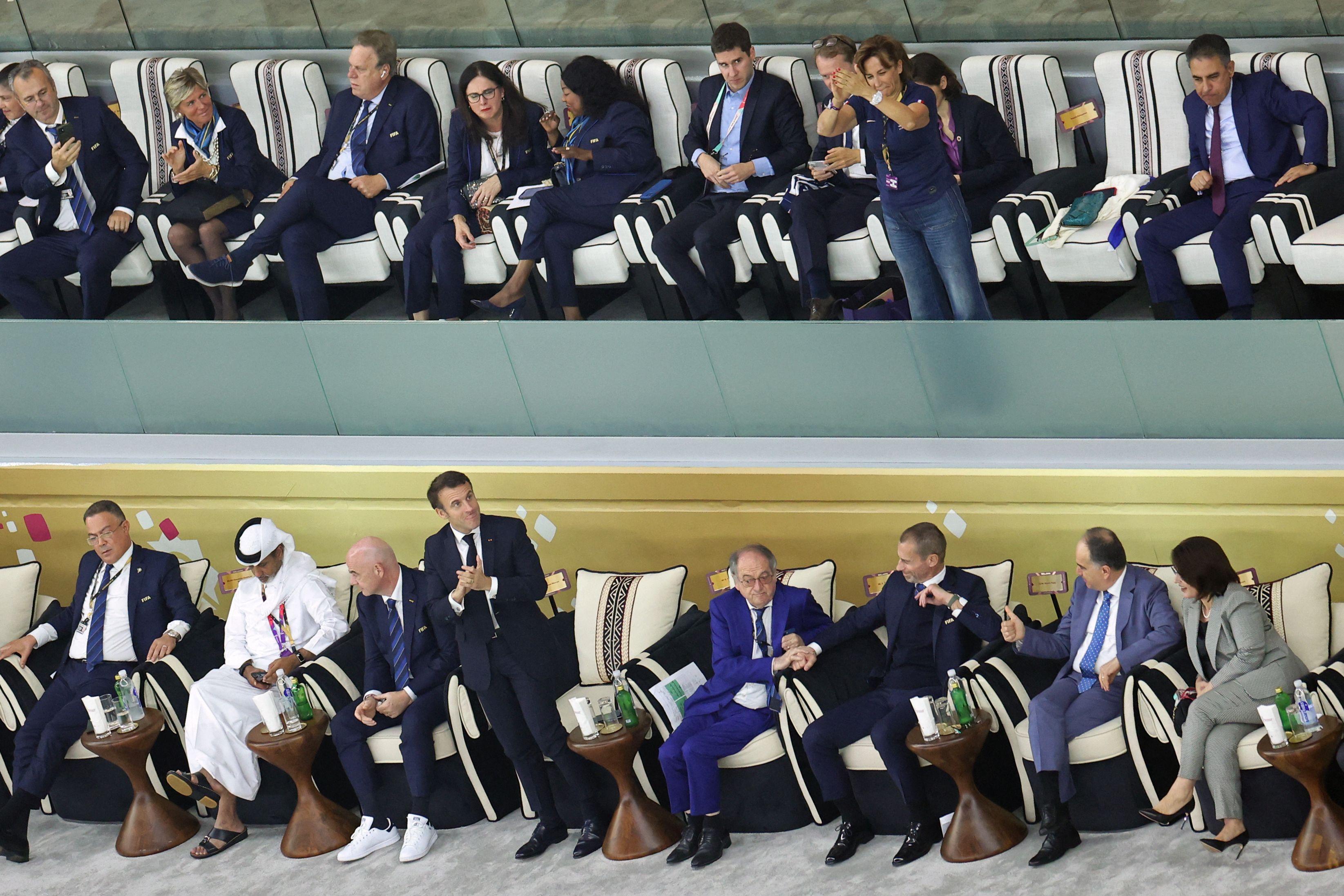 French President Emmanuel Macron reacts during the Qatar 2022