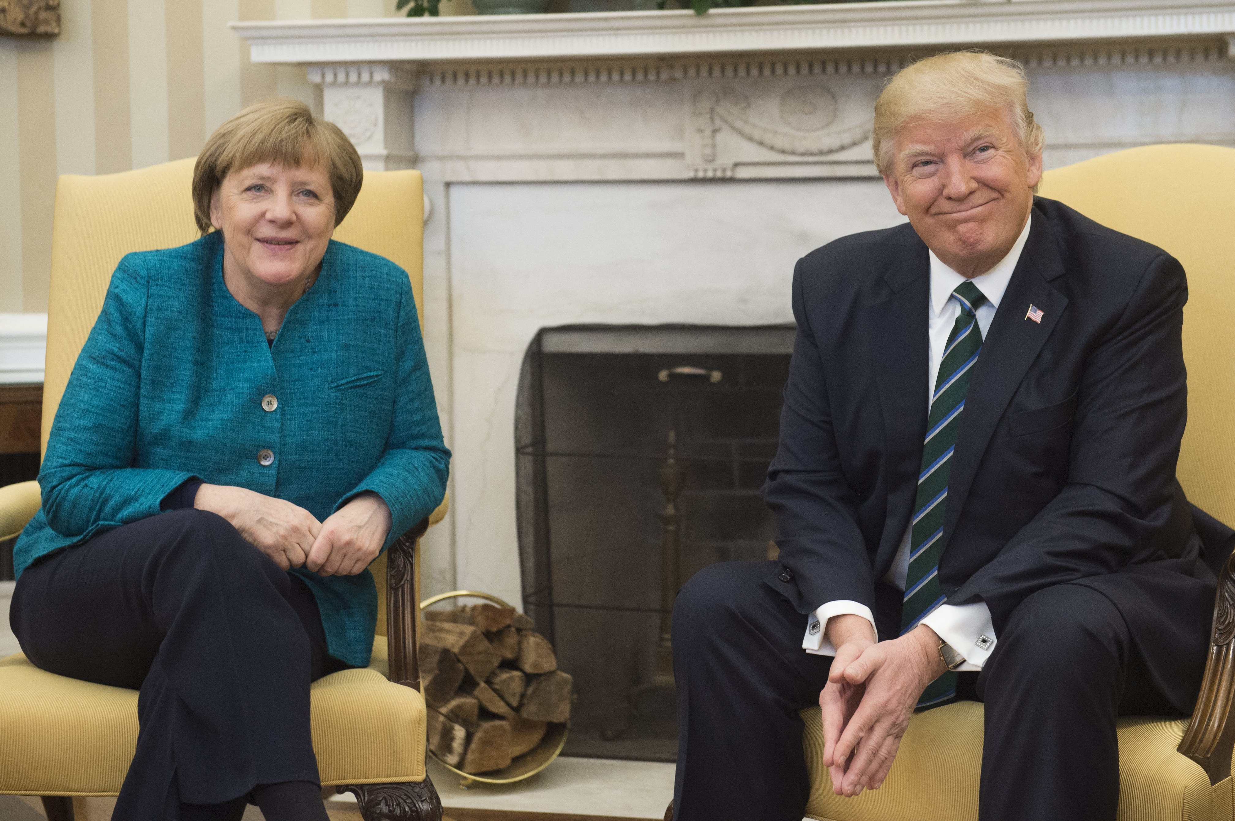 (FILES) US President Donald Trump and German Chancellor Angela Merkel meet in the Oval Office of the White House in Washington, DC, on March 17, 2017.