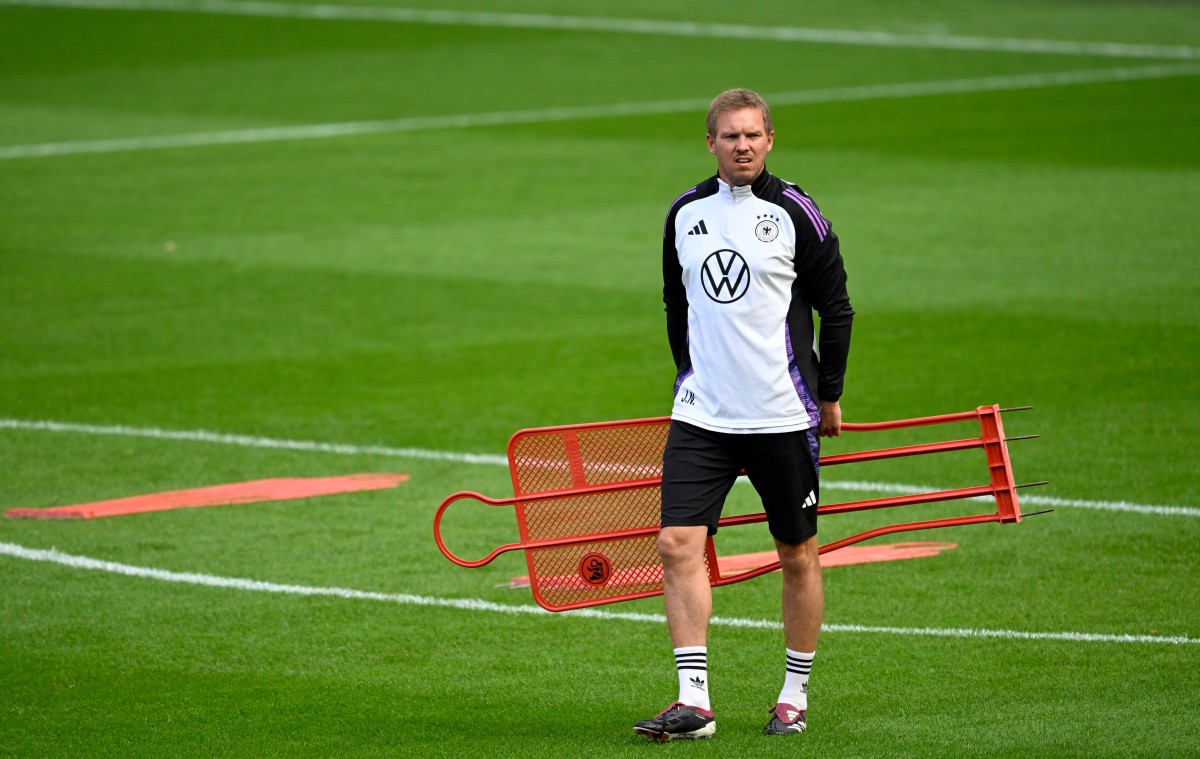 (FILES) Germany's head coach Julian Nagelsmann walks over the pitch during a training of Germany's football team on September 6, 2025 in Cologne, western Germany, on the eve of the 2026 World Cup qualifiers Europe zone group A football match between Germany and Northern Ireland.