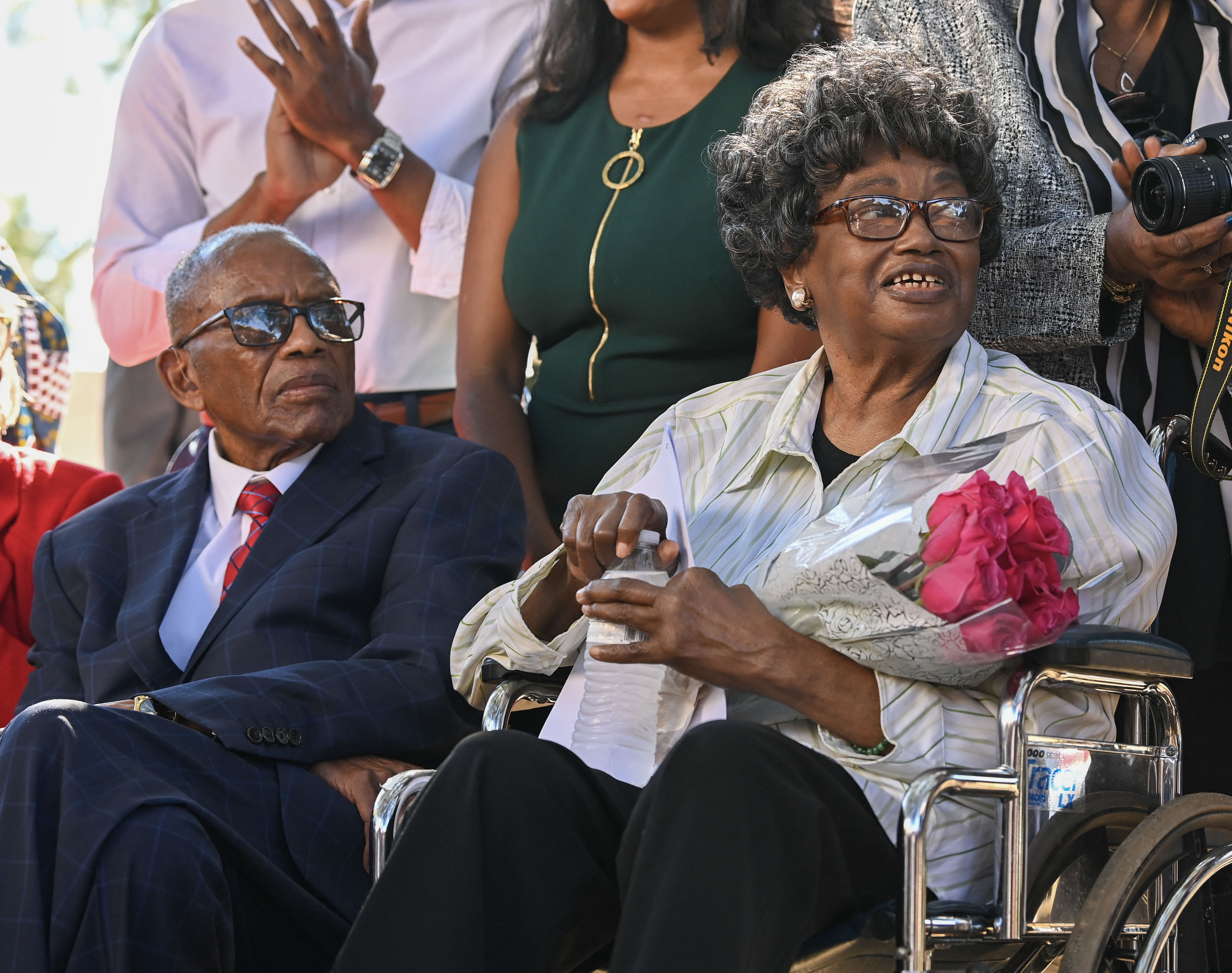 African American civil rights pioneer Claudette Colvin (R) and civil rights attorney Fred Gray listen during a press conference after Colvin petitioned for her juvenile record to be expunged at the Montgomery County Family Court on October 26, 2021, in Montgomery, Alabama. Claudette Colvin, who refused to give up her seat in Alabama to a white woman on a segregated bus in 1955, has died aged 86, her foundation said on January 13, 2026. At age 15, Colvin was arrested and placed on indefinite probation in Montgomery for violating bus segregation ordinances, several months before Rosa Parks made a similar protest that became a key moment in the birth of the modern civil rights movement in the United States. (Photo by Julie Bennett / GETTY IMAGES NORTH AMERICA / AFP)