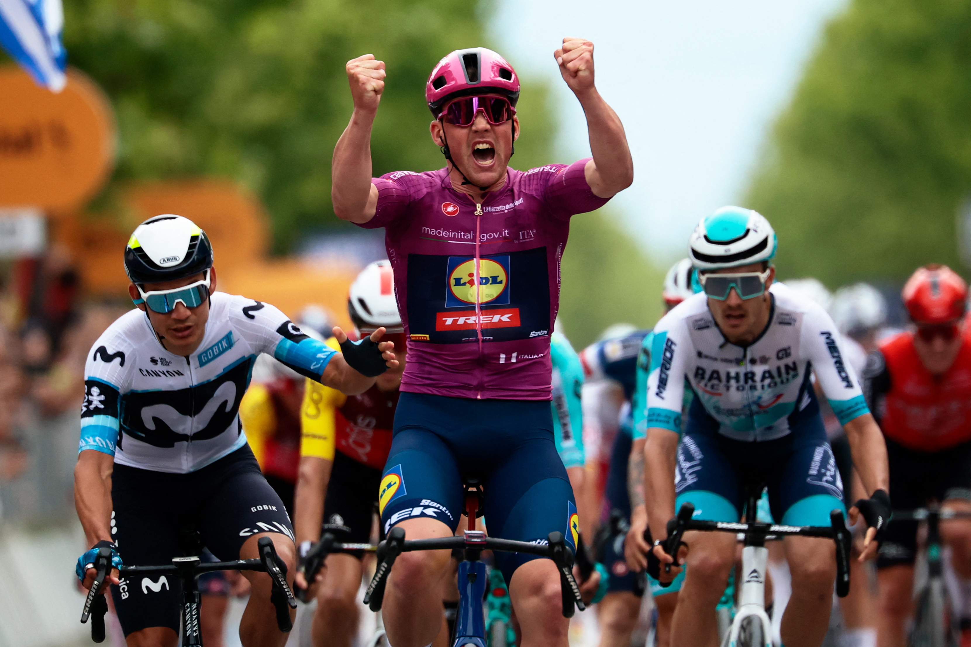 Lidl-Trek's Danish rider Mads Pedersen wearing the points classification mauve jersey (Maglia Ciclamino) celebrates as he crosses the finish line to win the 3rd stage of the 108th Giro d'Italia cycling race, 160km from Vlore to Vlore in Albania, on May 11, 2025.  (Photo by Luca Bettini / AFP)