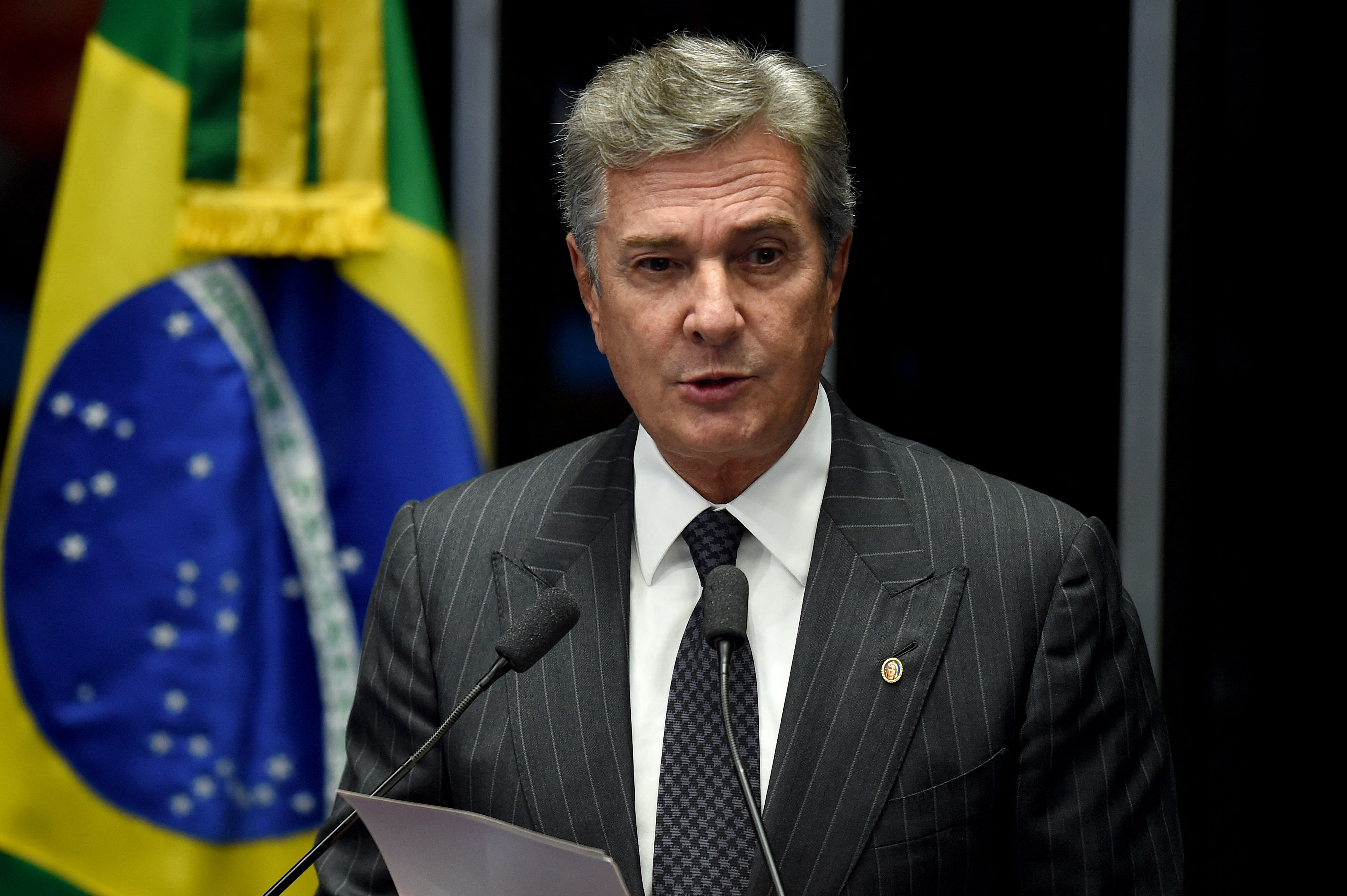 (FILES) Brazilian Senator and former President (1990-1992) Fernando Collor de Mello delivers a speech during the debate on suspending and impeaching President Dilma Rousseff in Brasilia on May 11, 2016.