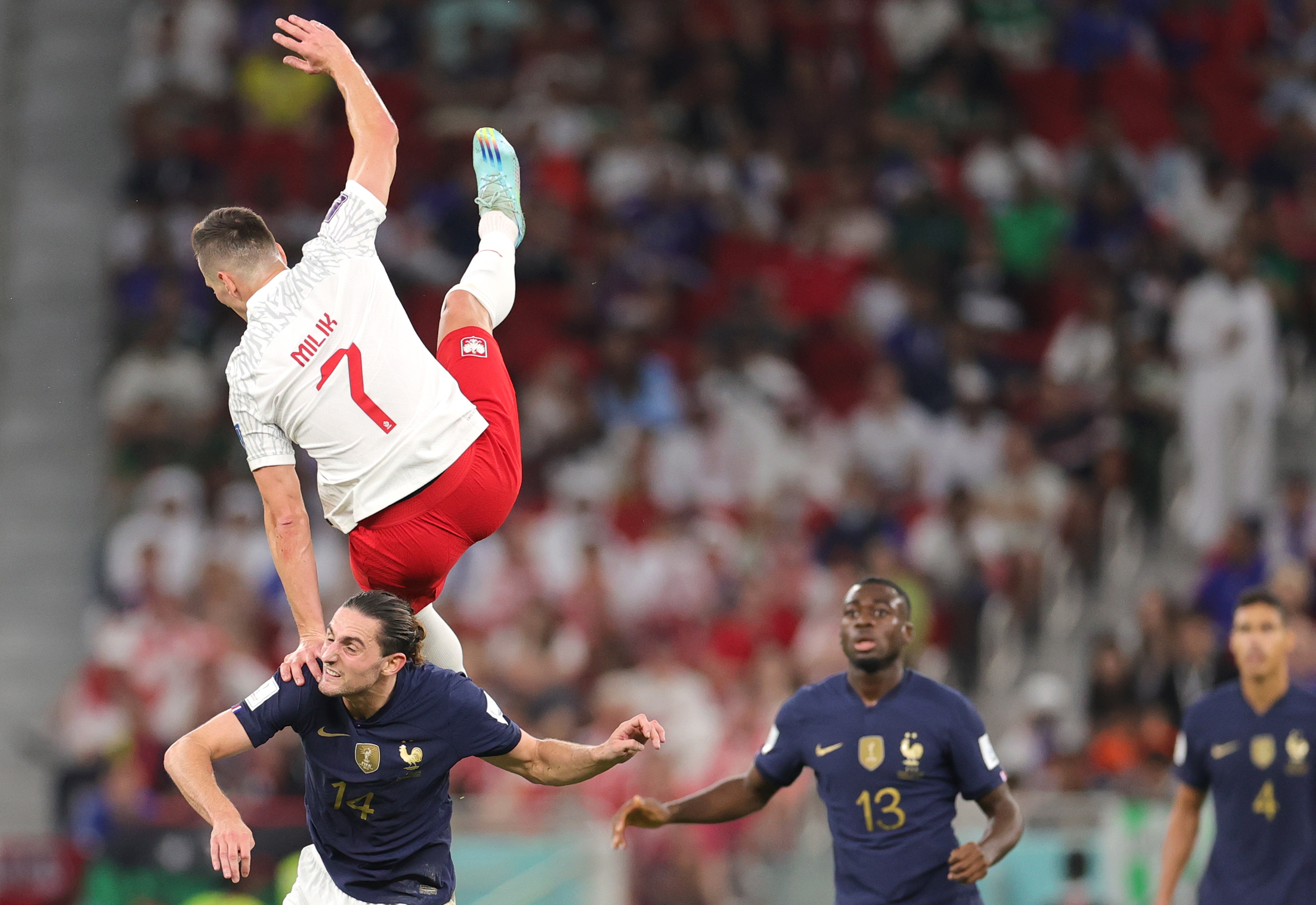Doha (Qatar), 04/12/2022.- Adrien Rabiot of France in action against Arkadiusz Milik (up) of Poland during the FIFA World Cup 2022 round of 16 soccer match between France and Poland at Al Thumama Stadium in Doha, Qatar, 04 December 2022. (Mundial de Fútbol, Francia, Polonia, Catar) EFE/EPA/Friedemann Vogel
