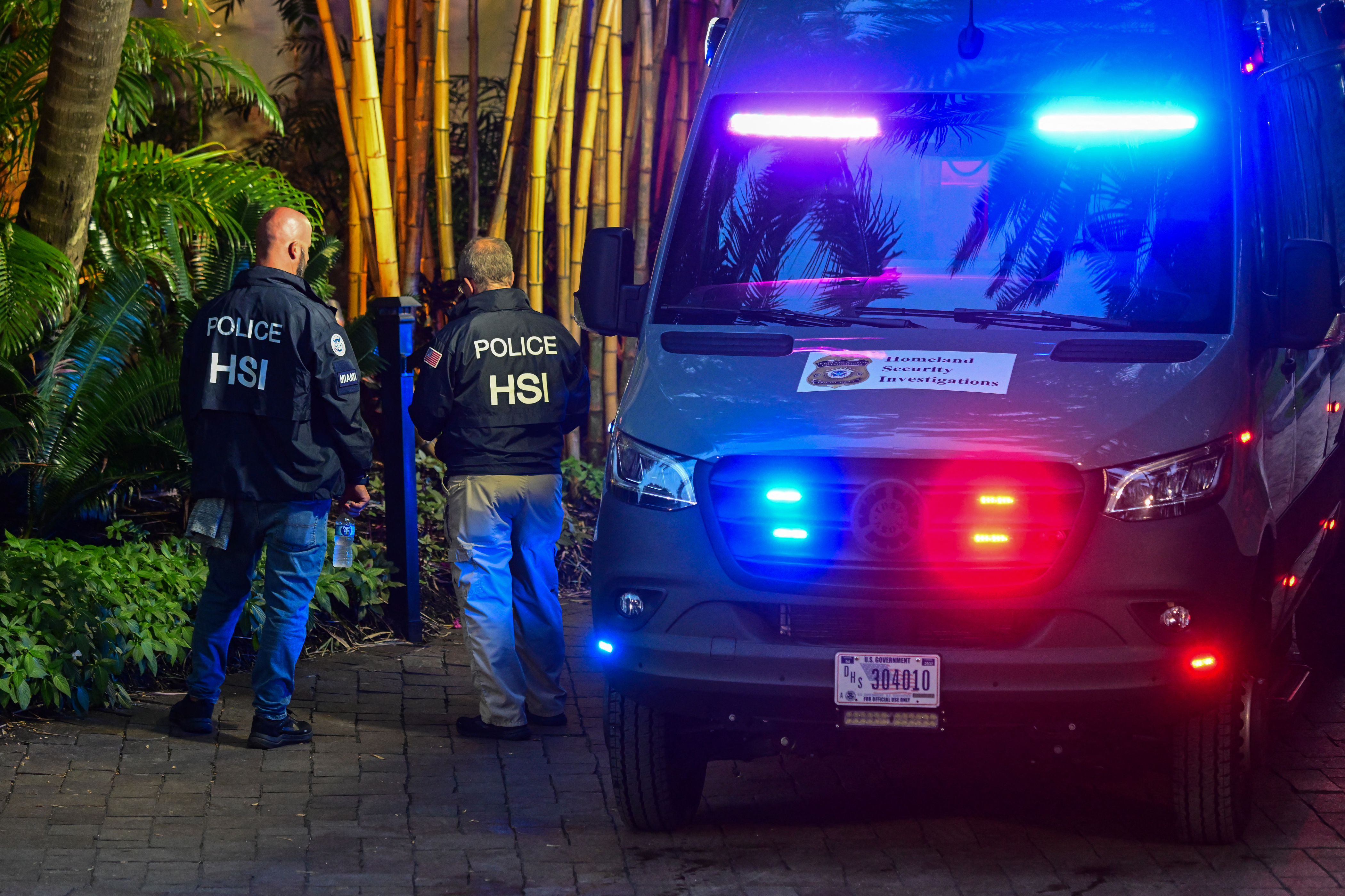 (FILES) Homeland Security Investigation agents are seen at the entrance of US producer and musician Sean "Diddy" Combs's home at Star Island in Miami Beach on March 25, 2024.