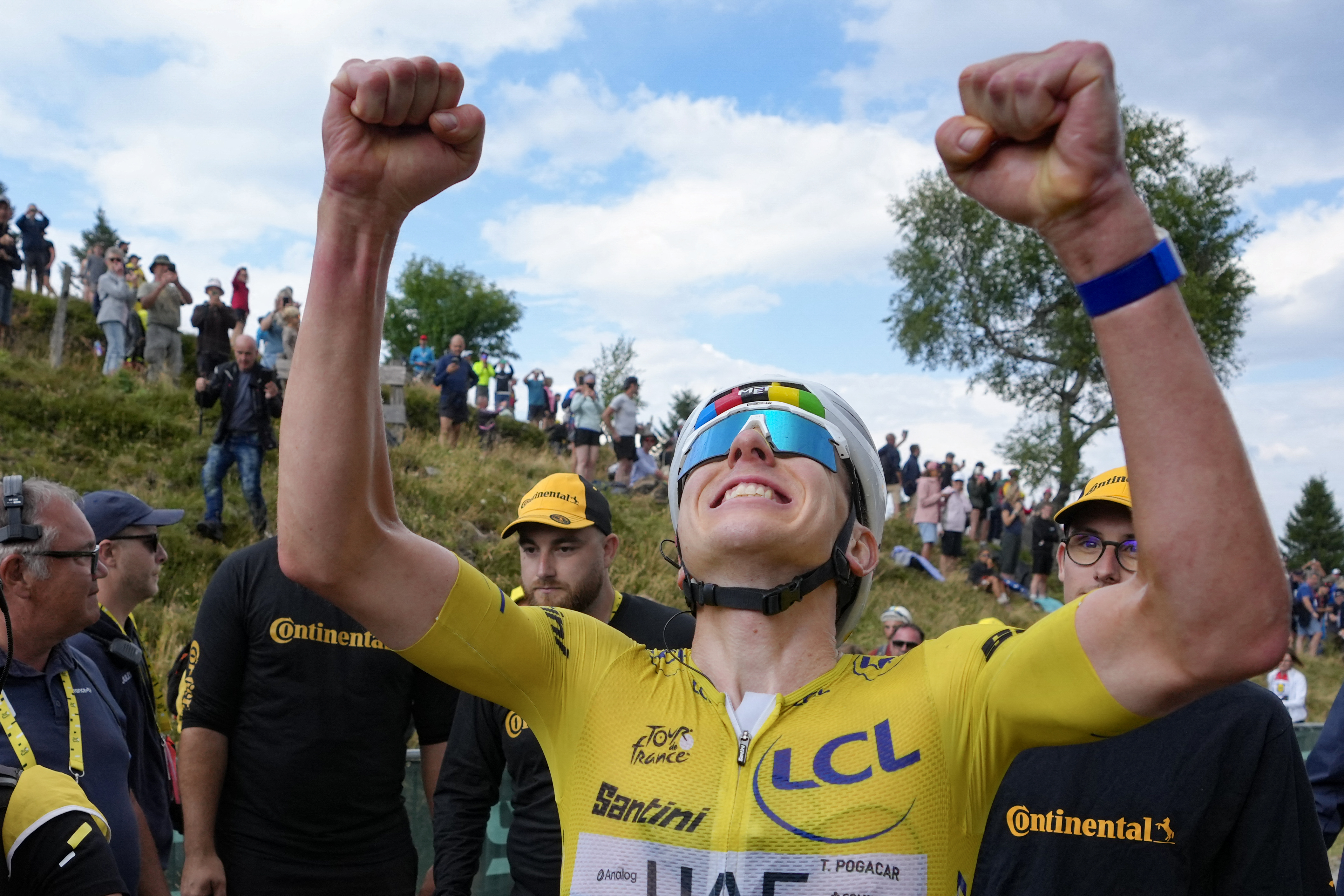 UAE Team Emirates - XRG's Slovenian rider Tadej Pogacar wearing the overall leader's yellow jersey celebrates after winning the 14th stage of the 113th edition of the Tour de France cycling race, 155 km between Mulhouse and Le Markstein in the Vosges mountains, on July 18, 2026. (Photo by Thibault Camus / POOL / AFP)