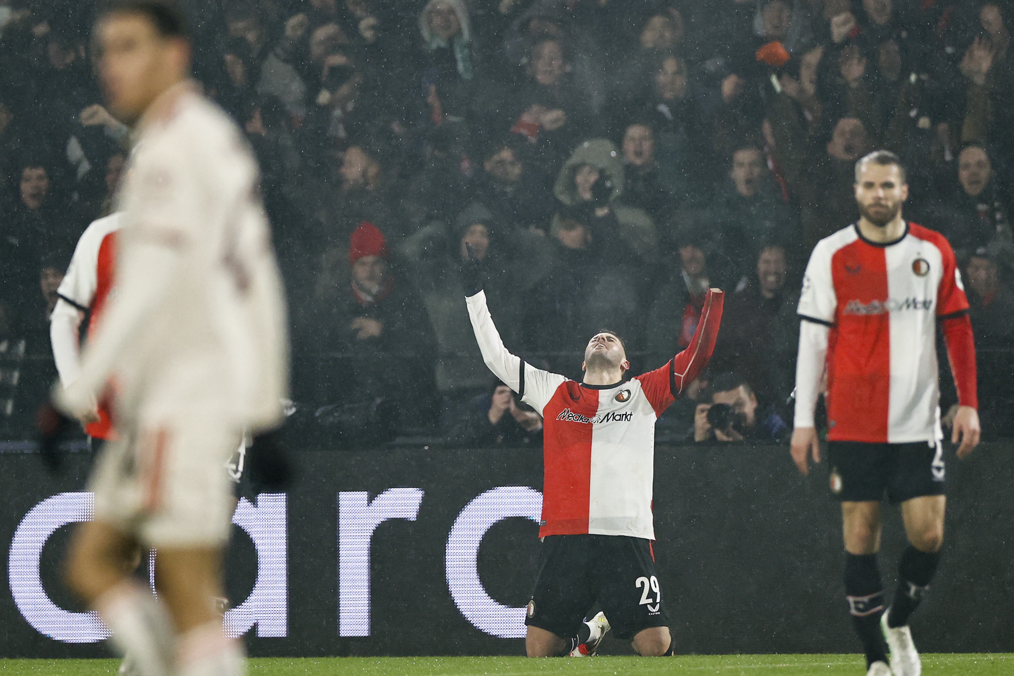 Feyenoord's Mexican forward #29 Santiago Gimenez (C) celebrates after scoring Feyenoord's first goal during the UEFA Champions League, league phase day 7, football match between Feyenoord (NED) and FC Bayern Munich (GER) at the Feyenoord Stadium in Rotterdam, on January 22, 2025.