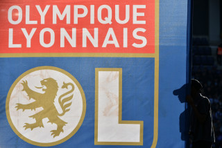 (FILES) The flag with the logo of Olympique Lyonnais is seen during the French Ligue 1 football match between Toulouse FC (TFC) and Olympique Lyonnais (OL) on October 29, 2016, at the Municipal Stadium in Toulouse southern France.