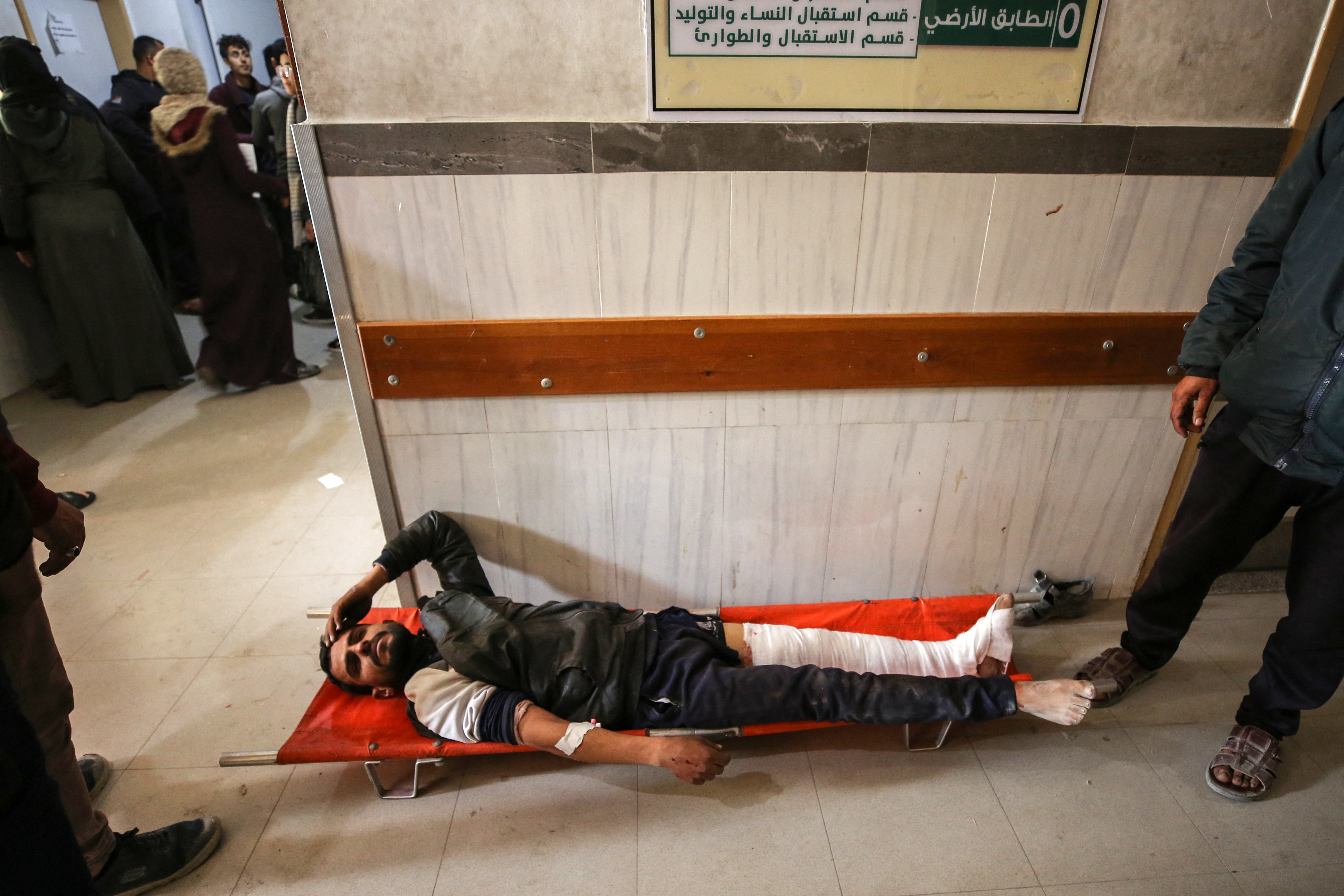 Palestinians receive medical care at Kamal Edwan Hospital in Beit Lahia, in the northern Gaza Strip, on February 29, 2024, after Israeli soldiers allegedly opened fire at Gaza residents who rushed towards trucks loaded with humanitarian aid amid ongoing battles between Israel and the militant Hamas group. A Gaza emergency doctor said on February 29 that Israeli forces shot dead at least 50 people who rushed towards trucks loaded with humanitarian aid for Gaza City residents. The Israeli army said it was "checking" the reports on the incident, while the United Nations' humanitarian office OCHA said it was "familiar with the reports". (Photo by AFP)