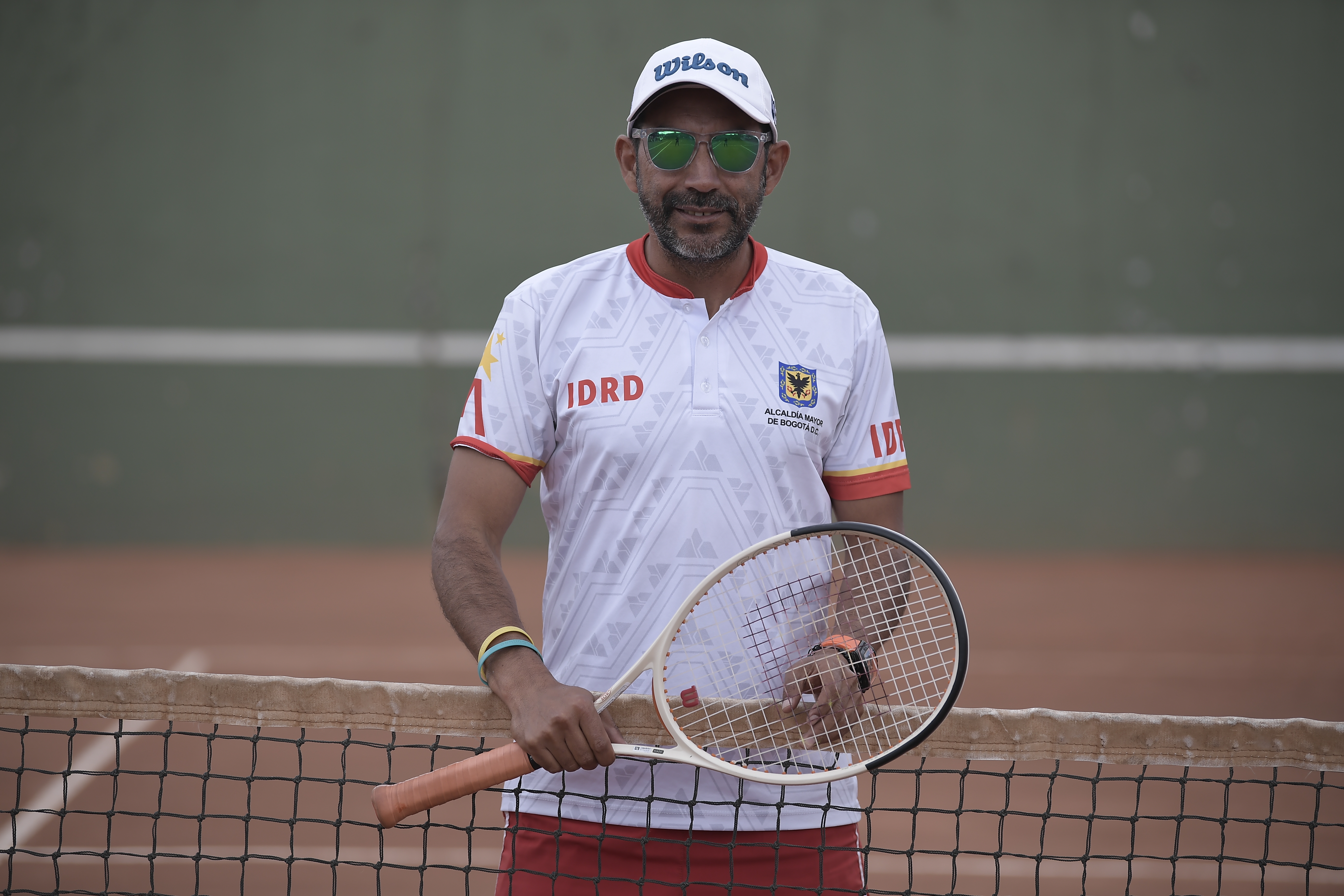 Entrenador de tenis en silla de ruedas