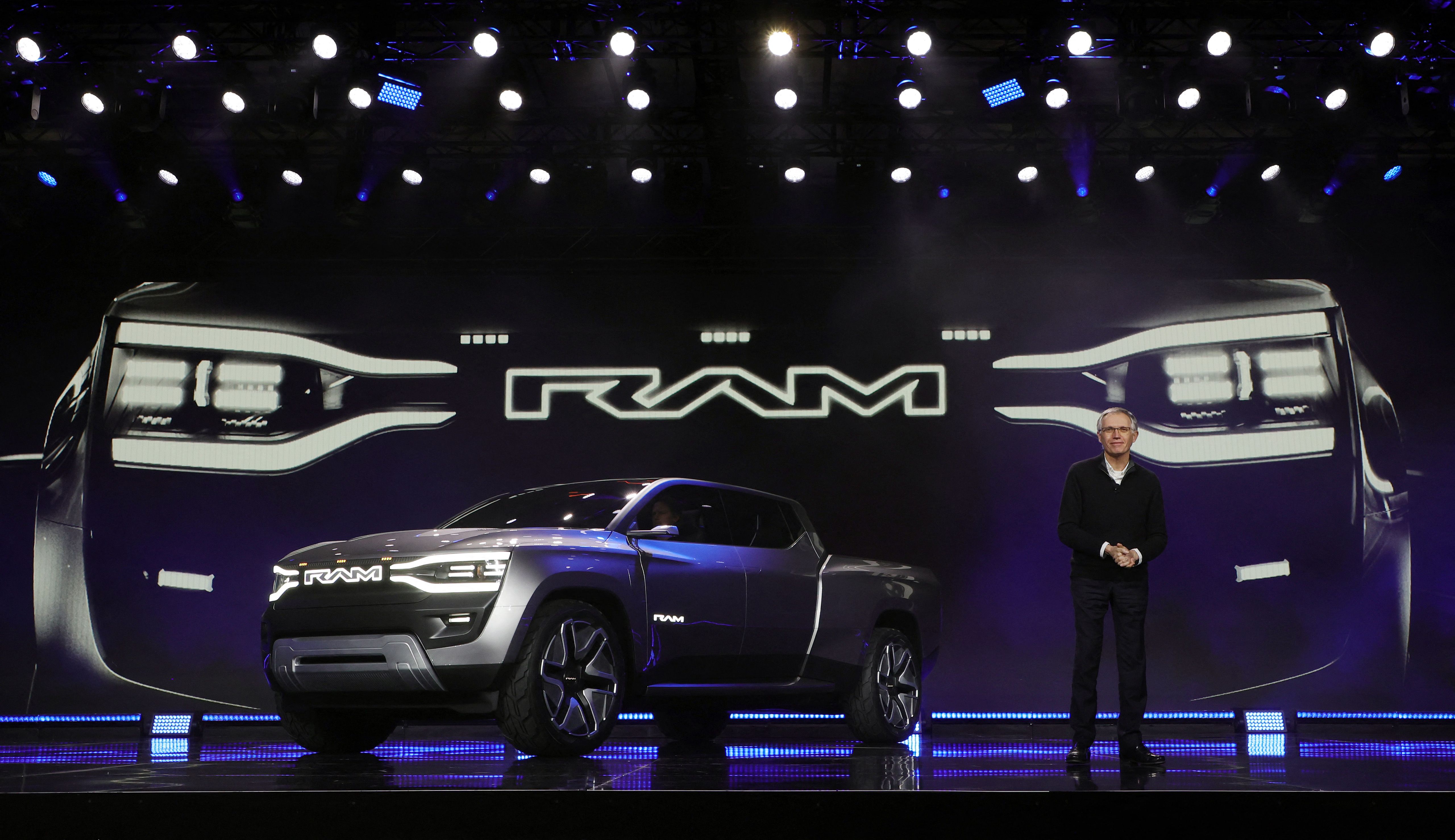 LAS VEGAS, NEVADA - JANUARY 05: Stellantis CEO Carlos Tavaras delivers a keynote address next to Stellantis' Ram 1500 Revolution battery-electric concept pickup truck that was introduced during CES 2023 at The Venetian Resort Las Vegas on January 05, 2023 in Las Vegas, Nevada. CES, the world's largest annual consumer technology trade show, runs through January 08 and features about 3,200 exhibitors showing off their latest products and services to more than 100,000 attendees. Ethan Miller/Getty Images/AFP (Photo by Ethan Miller / GETTY IMAGES NORTH AMERICA / AFP)