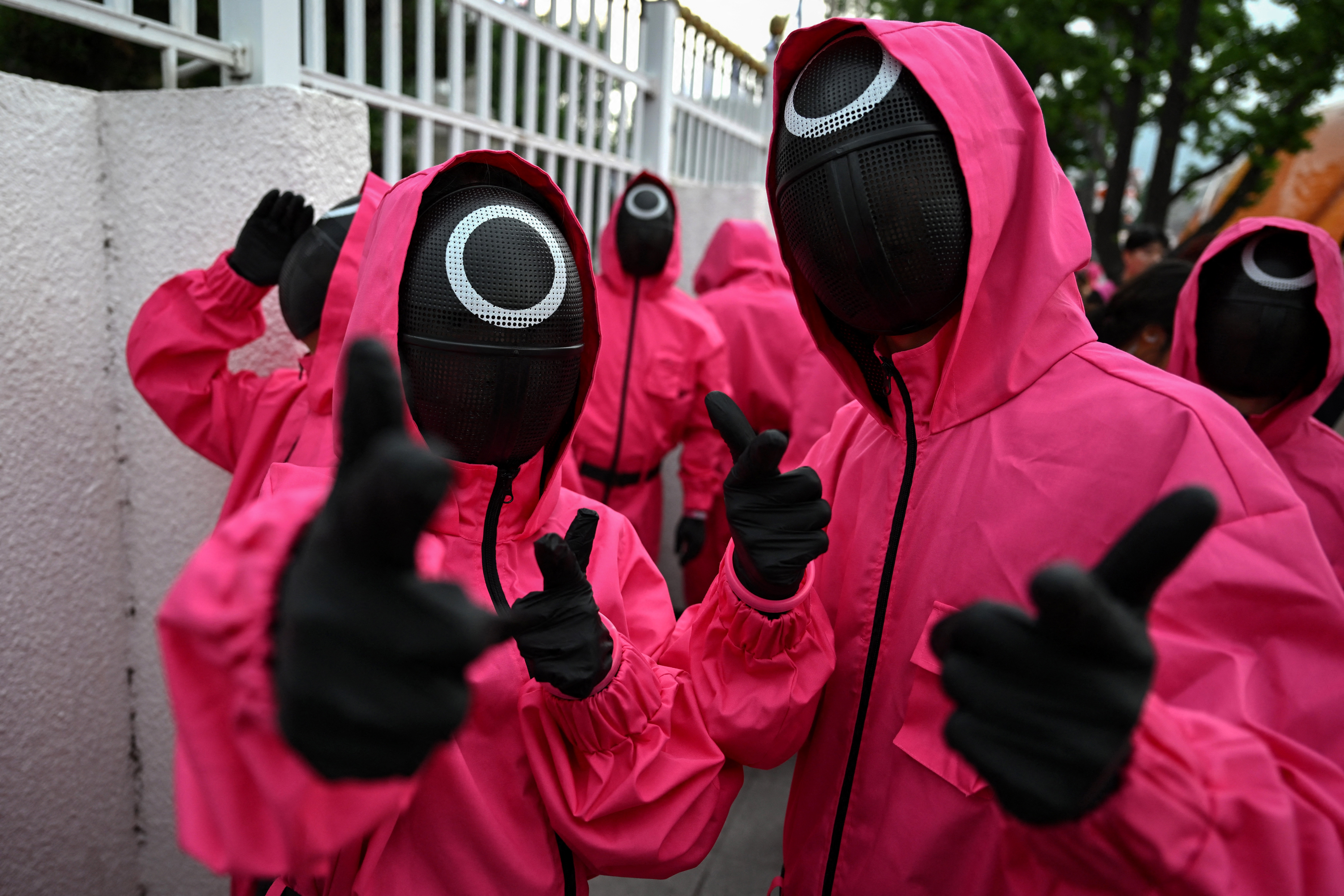 Pink Guards of Squid Game perform during a parade event for Netflix's South Korean TV series "Squid Game Season 3" at Gwanghwamun Square in Seoul on June 28, 2025.