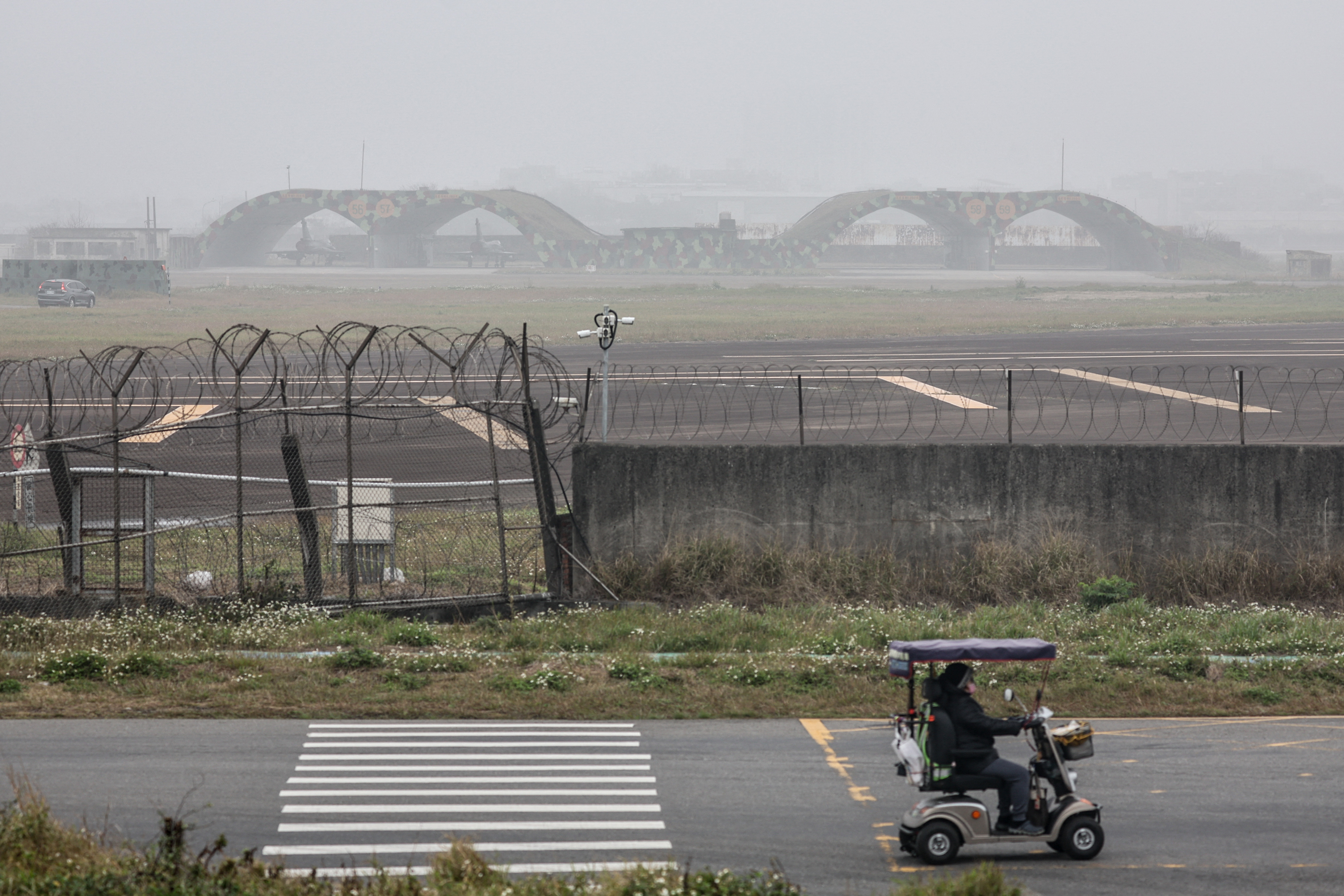 Two Taiwanese Air Force Mirage 2000 fighter jets (top) are seen at an air force base in Hsinchu on February 27, 2025.