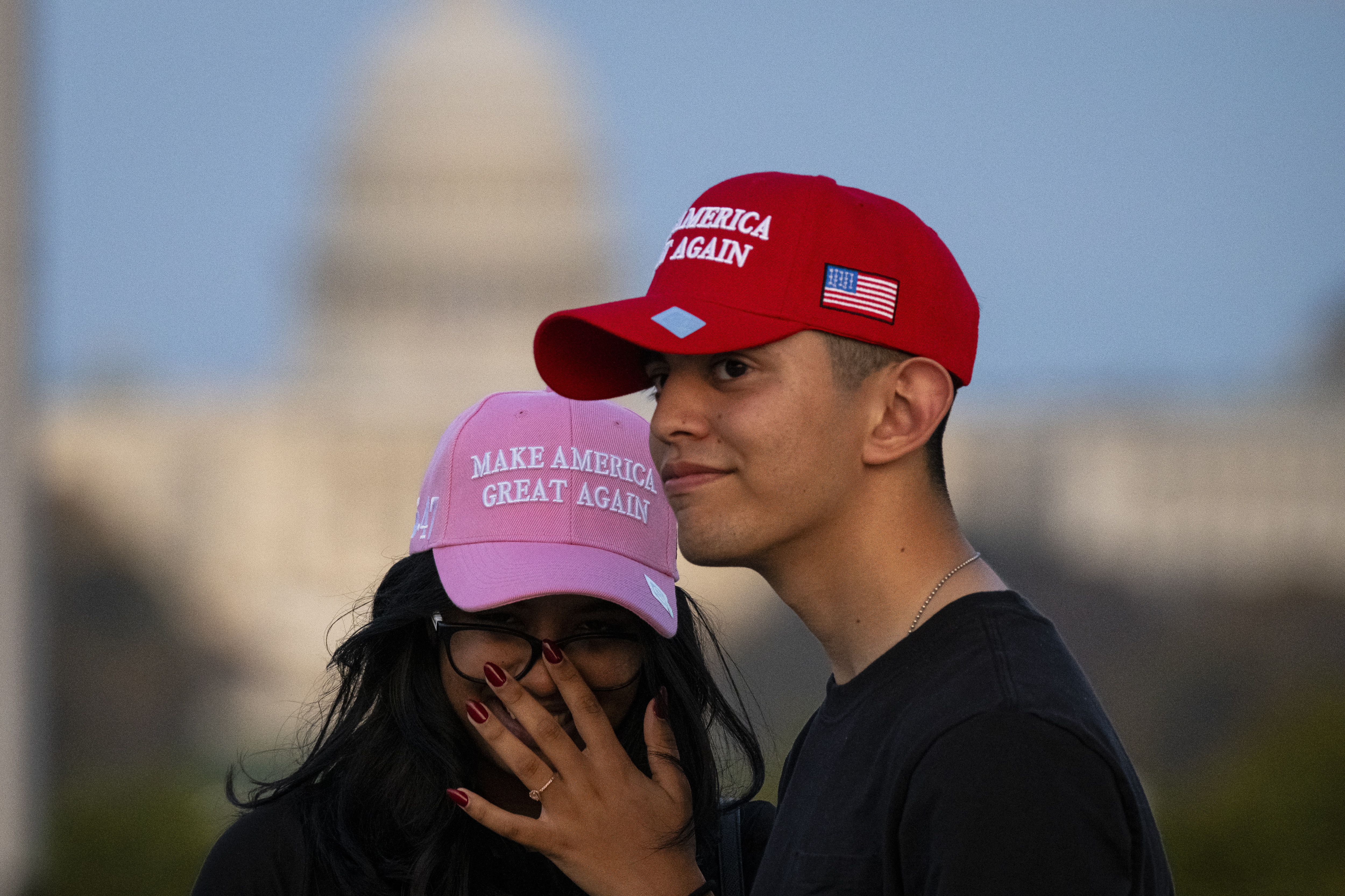 Washington (United States), 06/11/2024.- People wearing Make America Great Again hats on the National Mall are seen with the US Capitol Building in the background at dusk, in Washington, DC, USA, 06 November 2024. Republican presidential candidate Donald J. Trump was declared the winner of the 2024 US presidential election over Democratic presidential candidate US Vice President Kamala Harris. EFE/EPA/GRAEME SLOAN