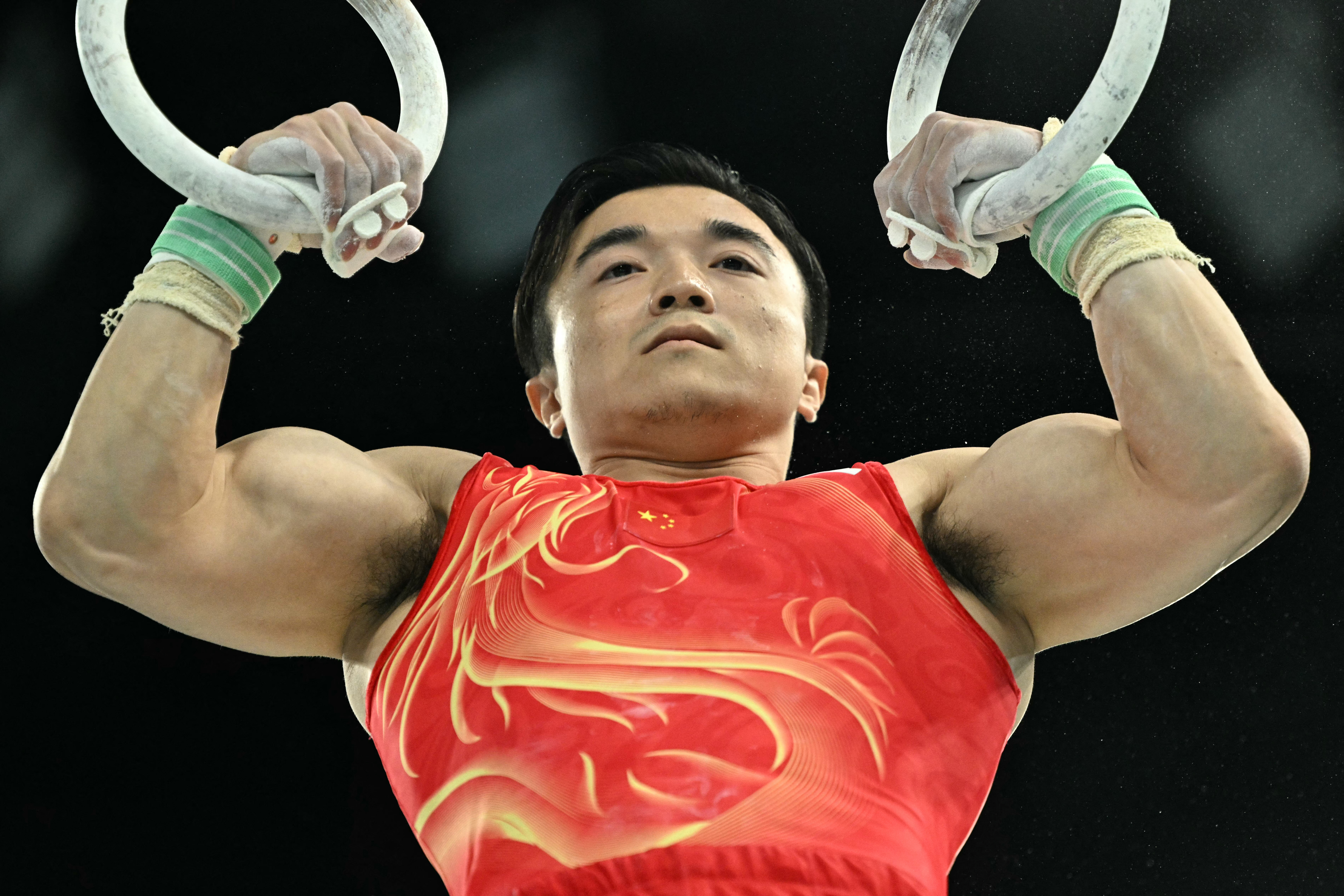 China's Liu Yang competes in the artistic gymnastics men's rings final during the Paris 2024 Olympic Games at the Bercy Arena in Paris, on August 4, 2024. (Photo by Lionel BONAVENTURE / AFP)