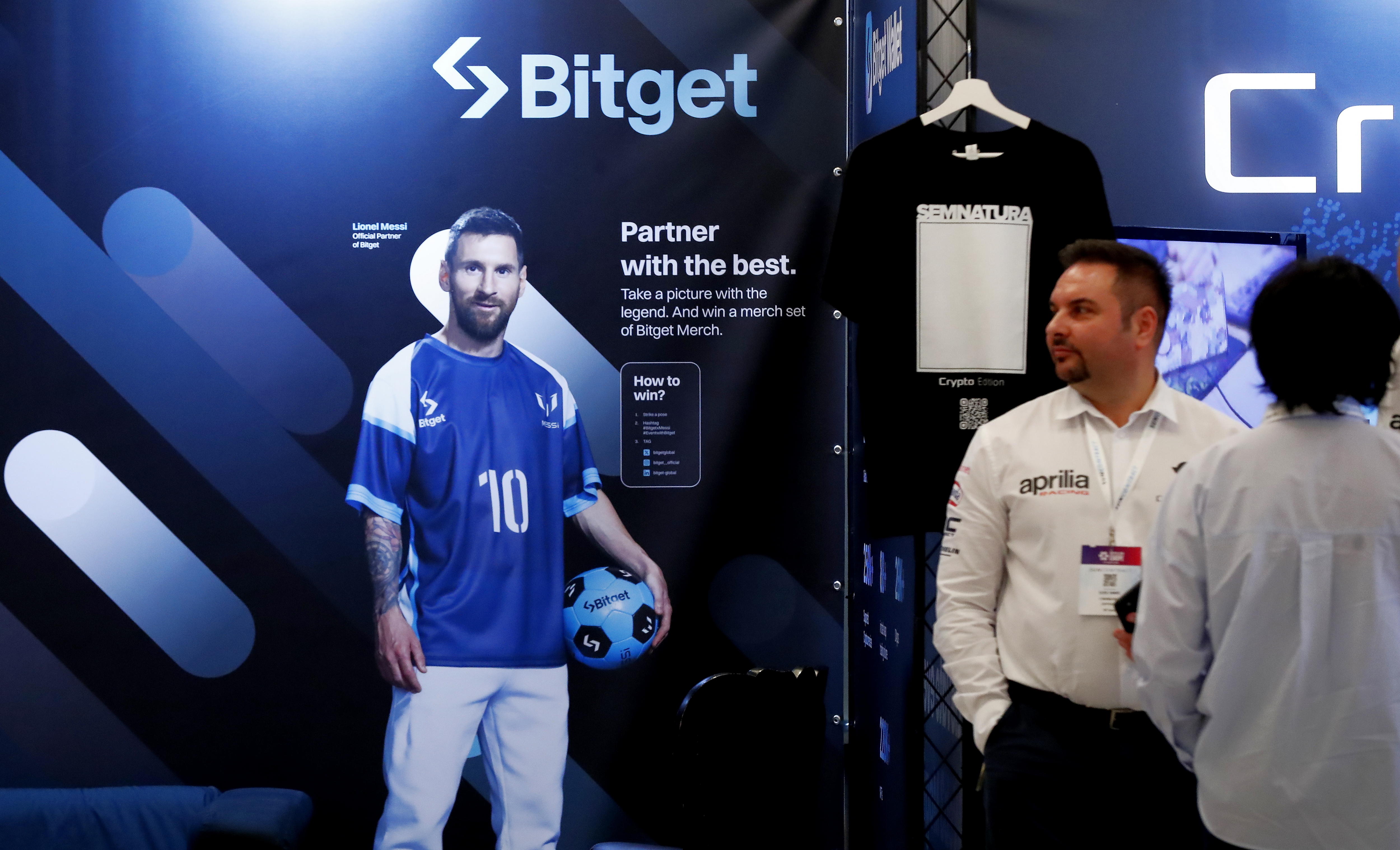 Bucharest (Romania), 04/03/2024.- Participanta, backed by an advertise poster showing Argentinian soccer star Lionel Messy at the Crypto Expo Europe 2024 conference in Bucharest, Romania, 04 March 2024. Bitget entered into a partnership with soccer star Lionel Messi in October 2022, becoming the only crypto exchange partner of the legendary Argentinean football player, and Messi was named Bitget brand ambassador. Crypto Expo Europe conference, held on 03 and 04 March in Bucharest, is one of the largest events in the crypto and blockchain industry, aiming on the crypto markets in Central and Eastern Europe and bringing together builders and top Web3 educators to boost a blockchain and fintech startup boom. The conference gathers more than 3,000 attendees, 115 speakers, 59 international exhibitors and organizing 81 workshops and seminars for the 2024 edition. (Rumanía, Bucarest) EFE/EPA/Robert Ghement