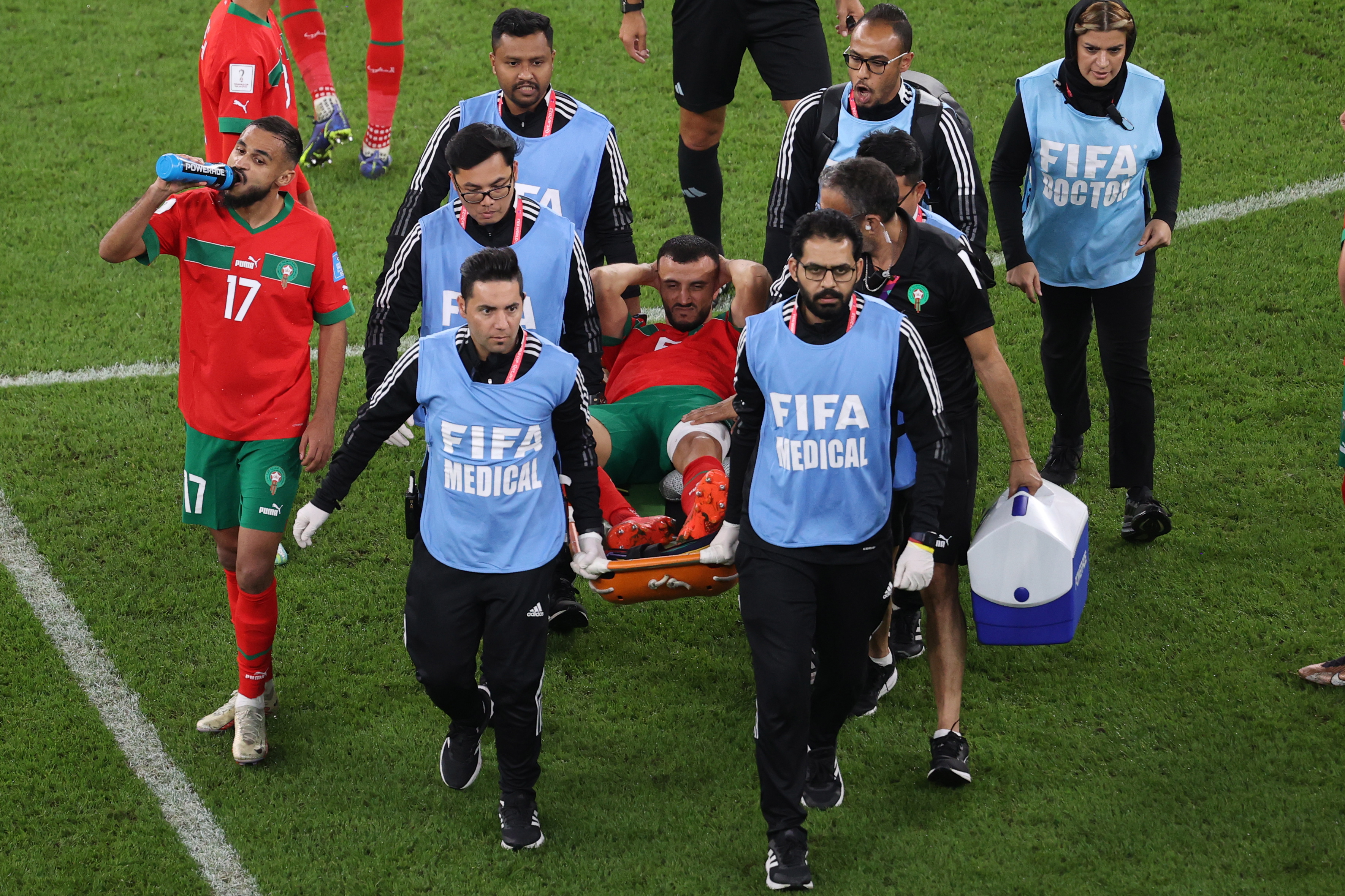 Doha (Qatar), 10/12/2022.- Medical personnel carry Romain Saiss off of the pitch after sustaining an injury during the FIFA World Cup 2022 quarter final soccer match between Morocco and Portugal at Al Thumama Stadium in Doha, Qatar, 10 December 2022. (Mundial de Fútbol, Marruecos, Catar) EFE/EPA/Abedin Taherkenareh